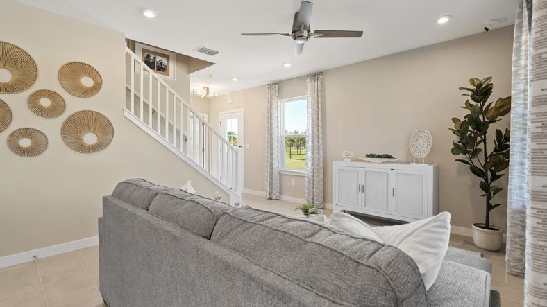 Cyrene at Harmony by DRB Homes offers an open living room with abundant natural light—bright, airy, and perfect for relaxing.