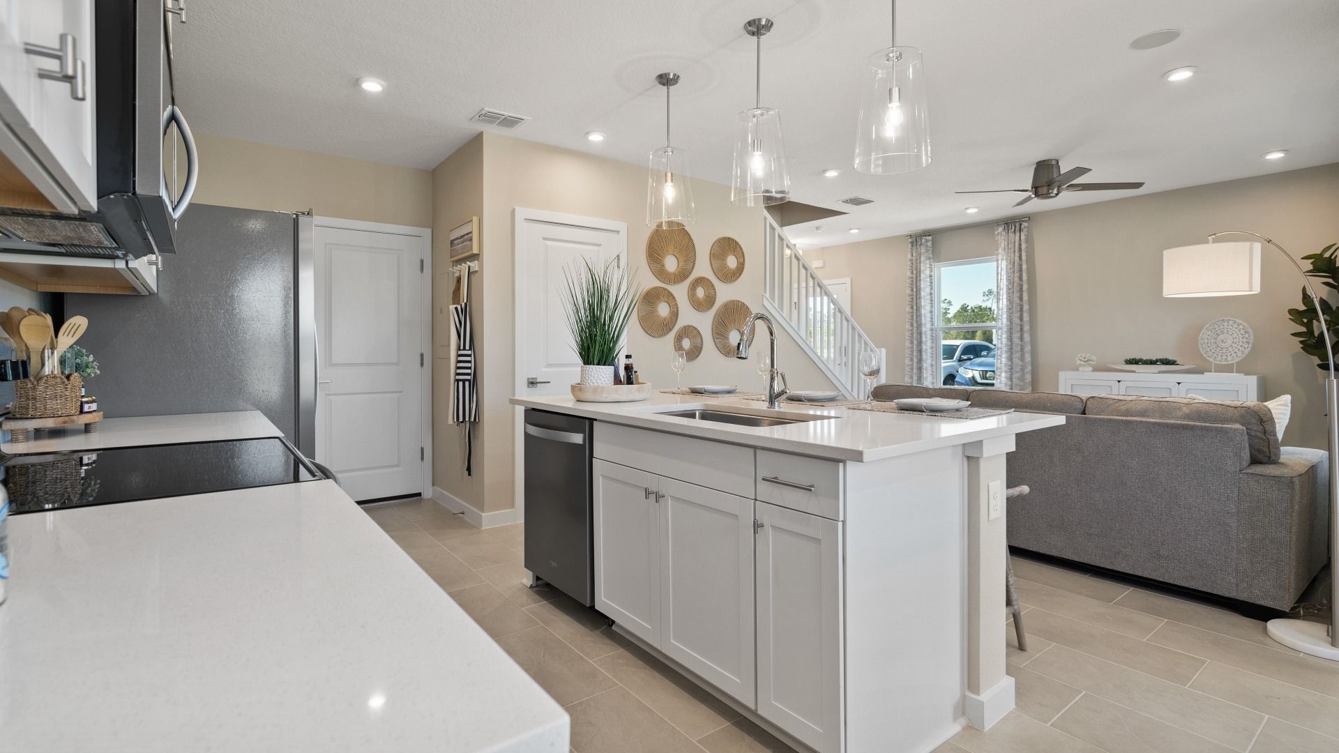 Cyrene at Harmony by DRB Homes offers an open-concept kitchen and living room—ideal for gathering with family and friends.