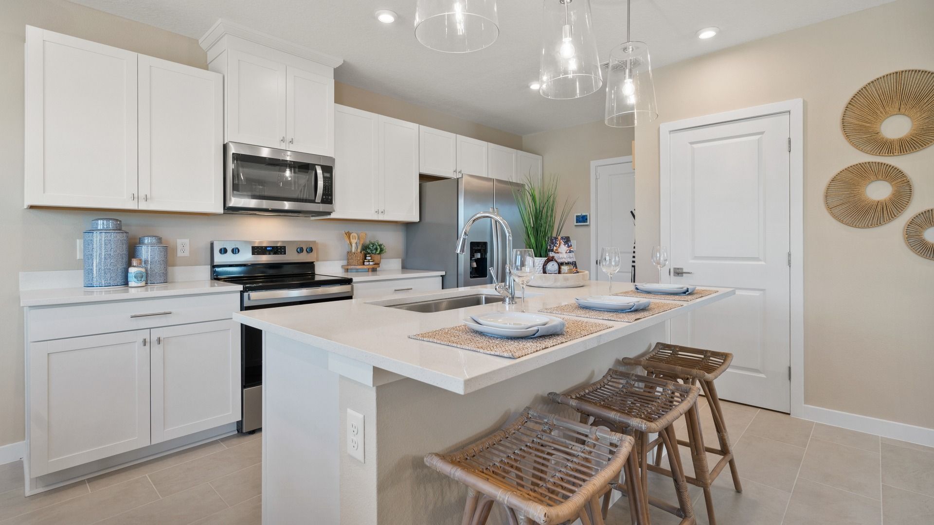 Cyrene at Harmony by DRB Homes in St. Cloud offers an open-space kitchen with modern finishes