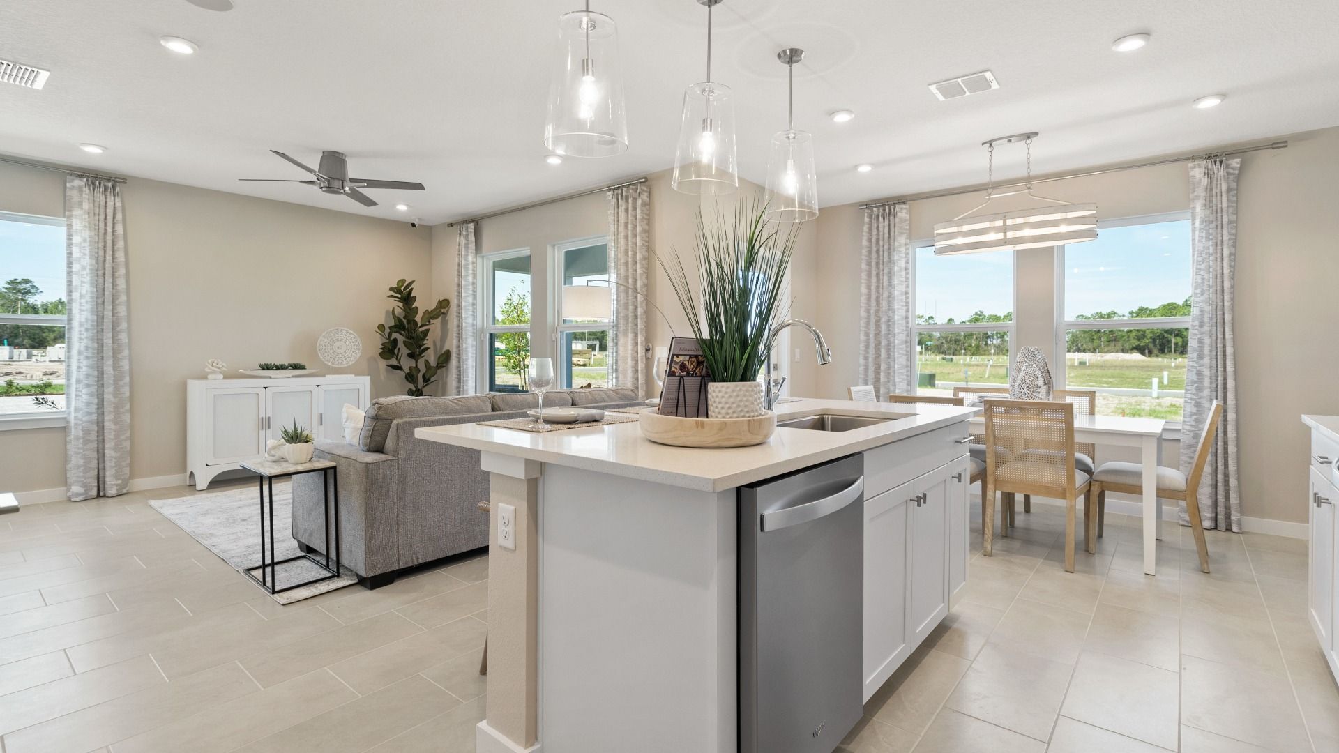 Cyrene at Harmony by DRB Homes offers an open-concept kitchen and living room—ideal for gathering with family and friends.