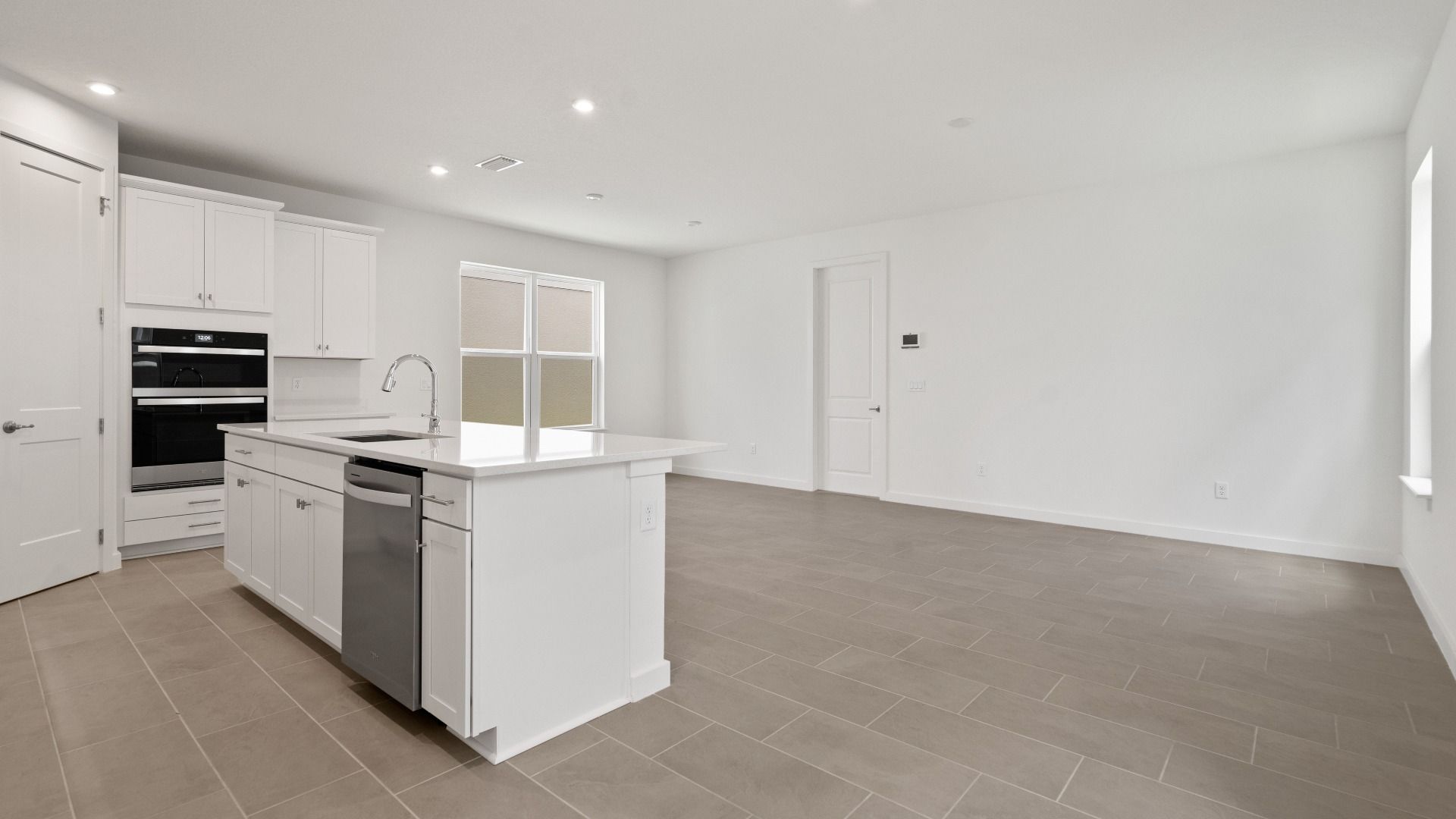 Spacious kitchen, living, and dining areas flow together seamlessly—ideal for everyday living and effortless entertaining.
