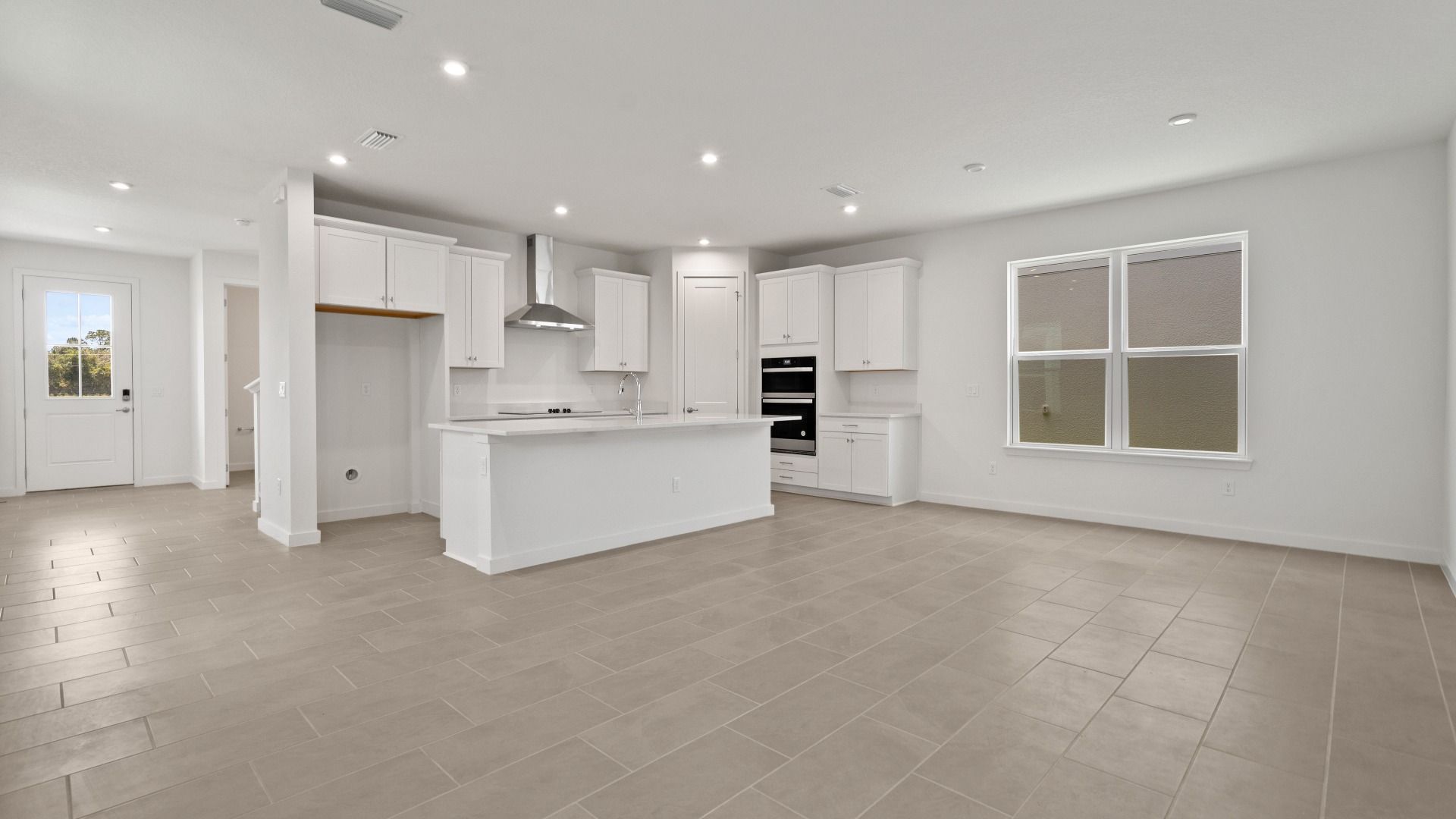 Spacious kitchen, living, and dining areas flow together seamlessly— DRB homes