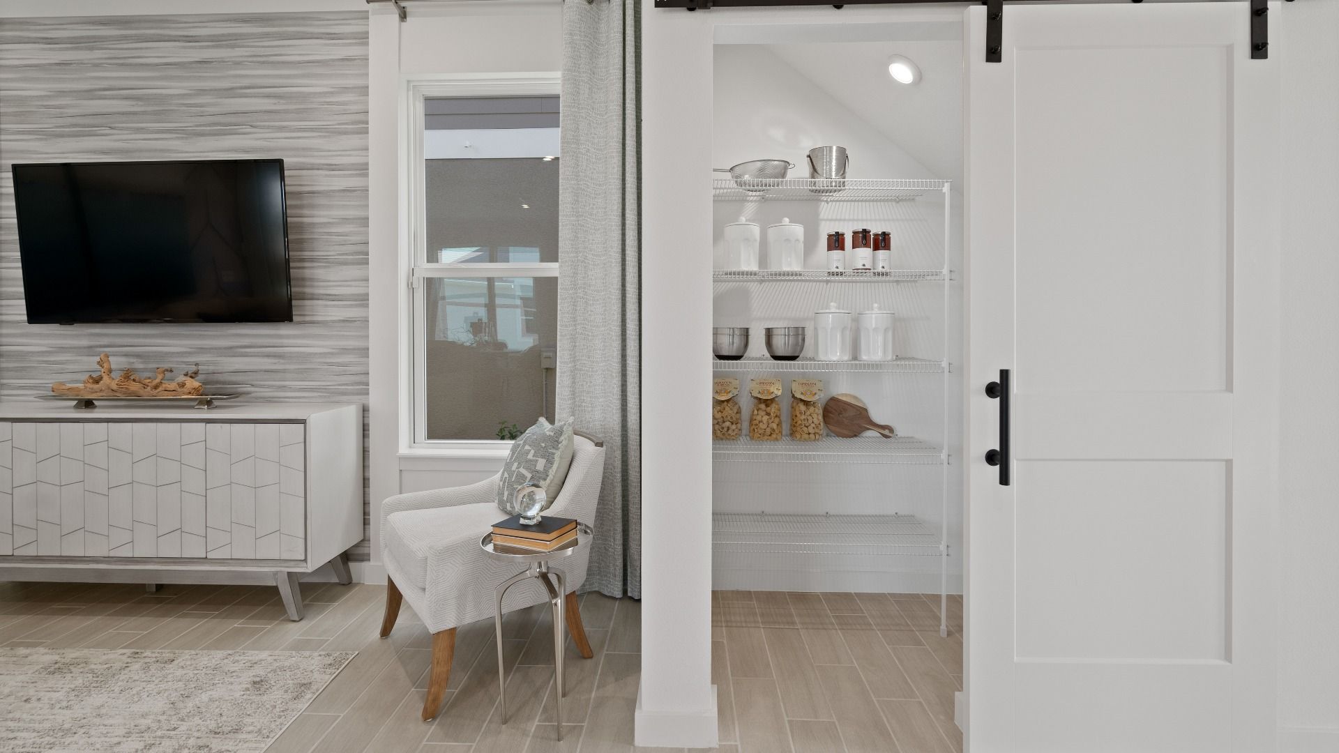 The kitchen pantry stores dry goods, canned food, and essentials at DRB homes