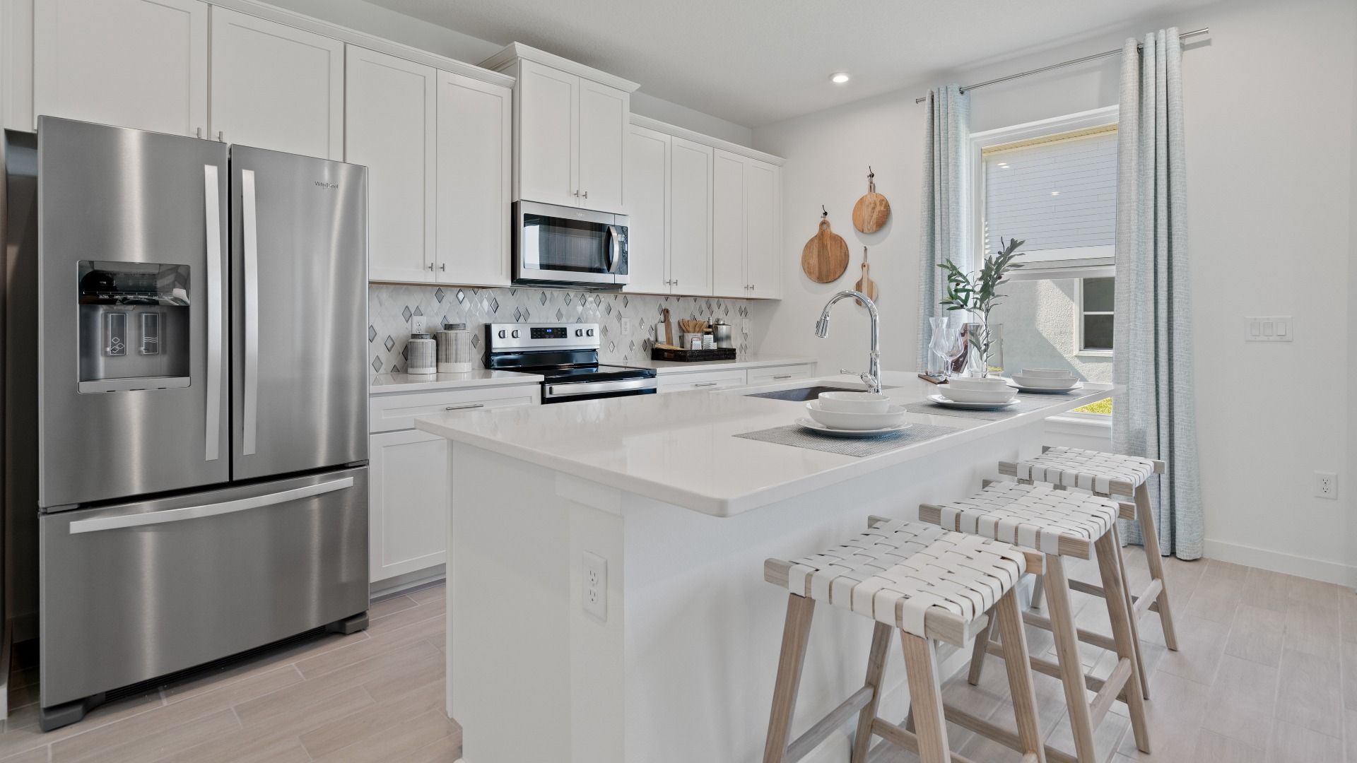 Open kitchen with sleek white cabinets, clean lines, and a bright, modern feel—perfect for cooking and gathering.