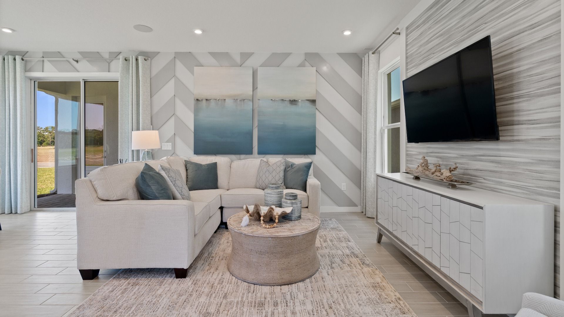 Open living room space with natural lighting at DRB homes