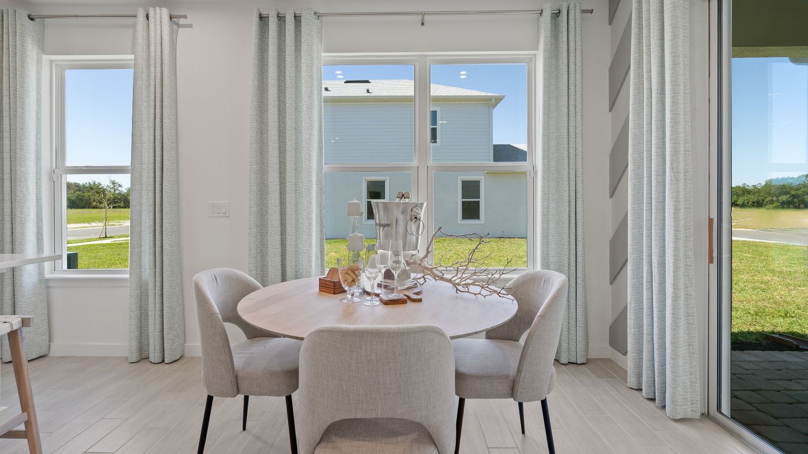 Dining room filled with natural light, creating a warm and welcoming space for meals at DRB homes