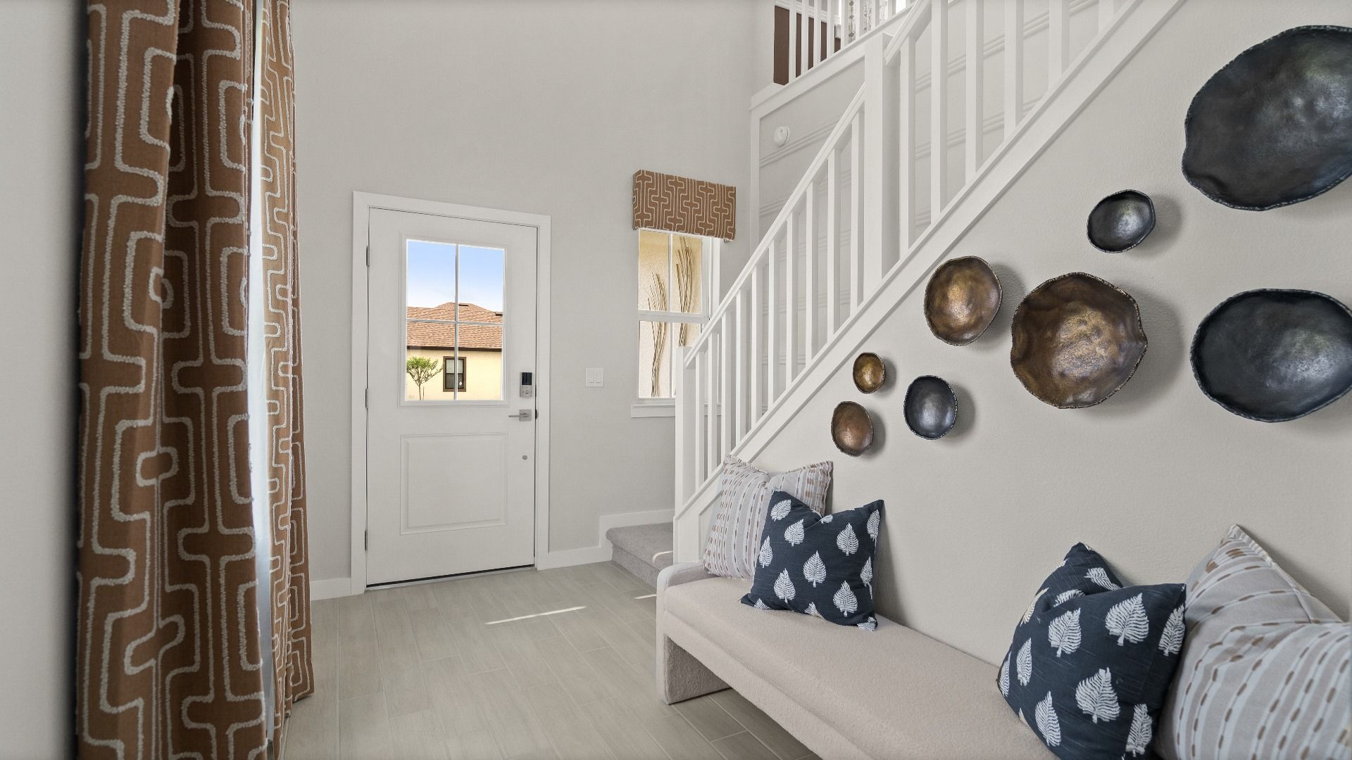 The Front Entry Way of a DRB Homes new construction Jupiter Model at Grasslands West in Lakeland, FL.