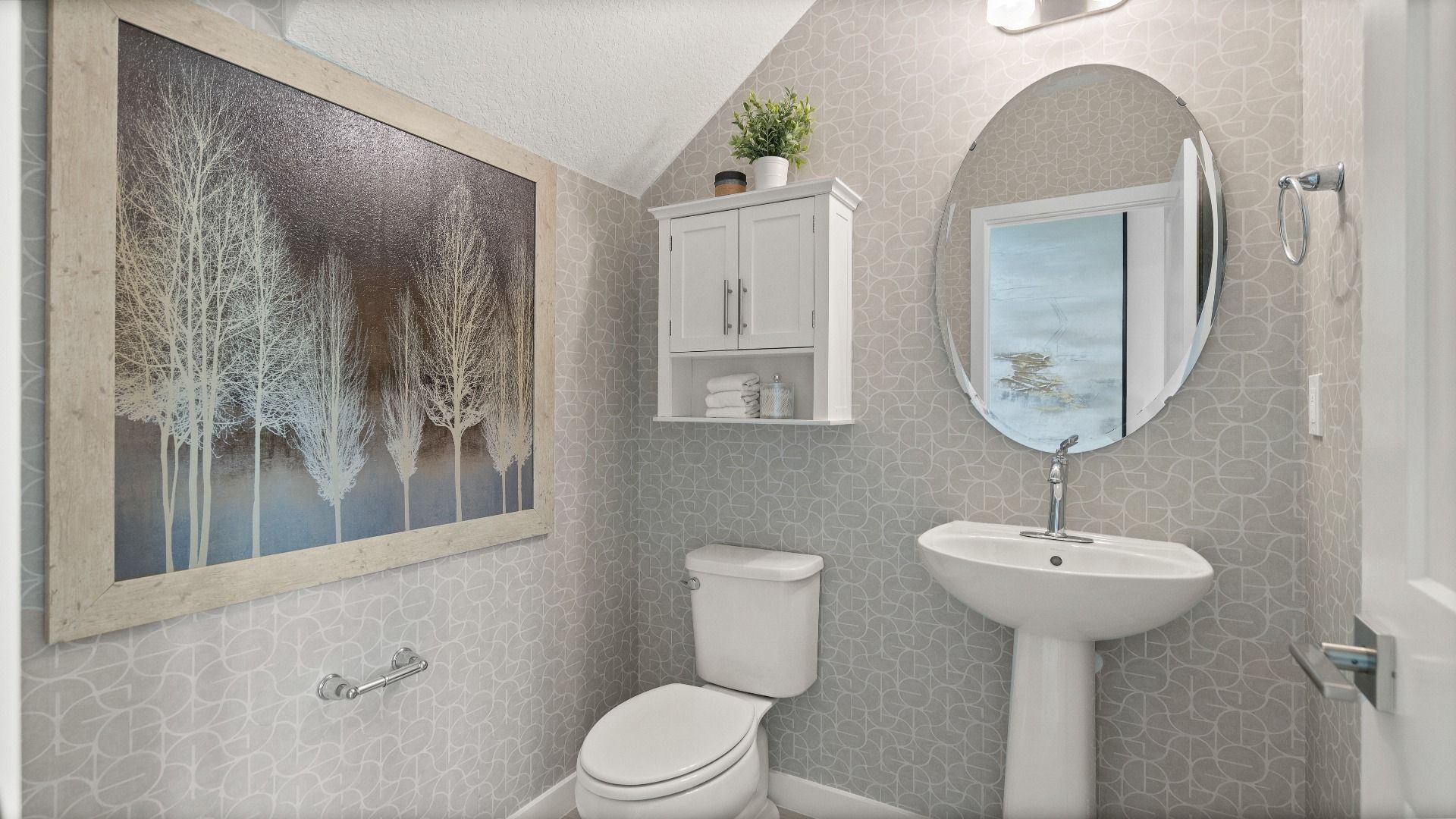 Downstairs Half Bathroom of a DRB Homes Jupiter Model at Grasslands West in Lakeland, FL.