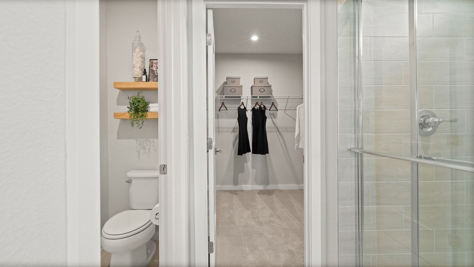Owner’s suite with private water closet, spacious walk-in closet, and tile shower in the Jupiter Model at Grasslands West.