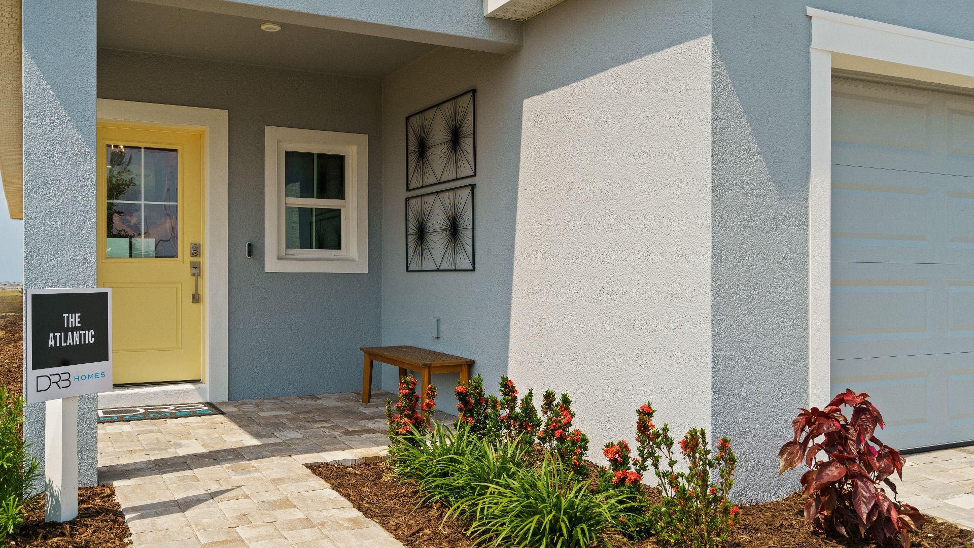 Welcome home to The Atlantic at Hamilton Bluff—featuring a covered entry, paver driveway, and inviting front entry.
