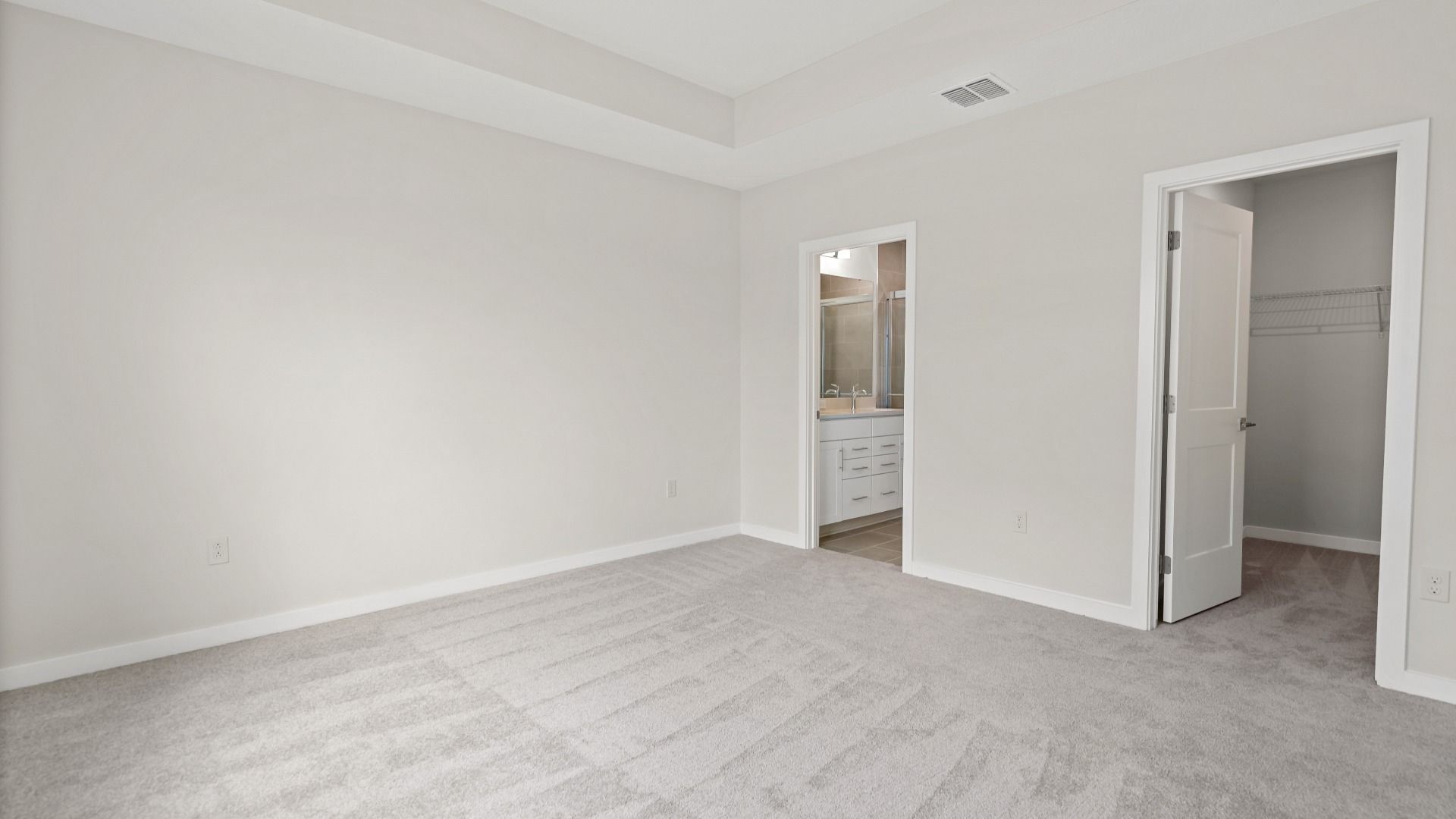 The Atlantic’s owner’s suite features plush carpet, a walk-in closet, and direct access to a spacious private bathroom.