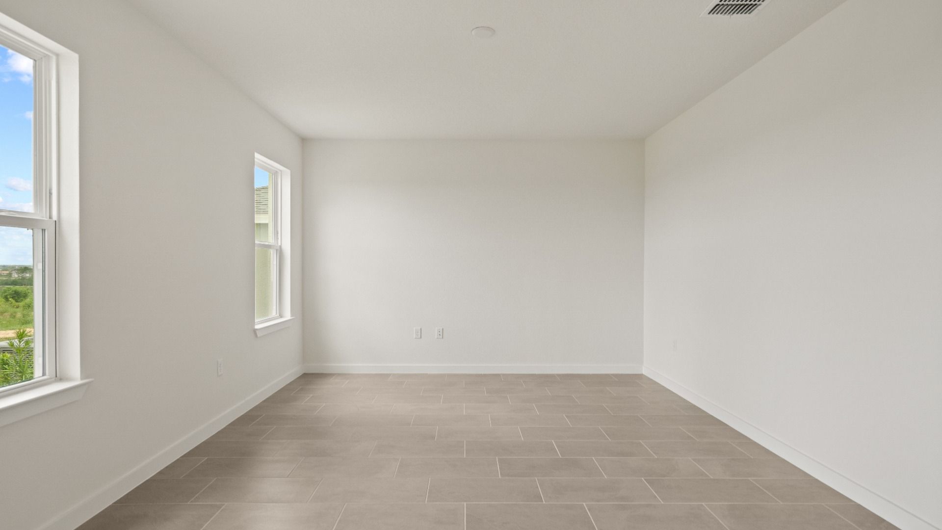 Open Concept Living Area with lots of natural light featuring two Large Windows
