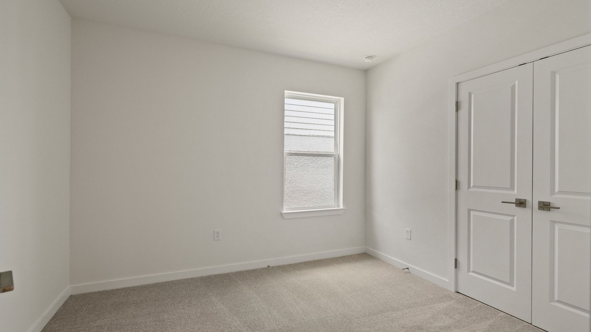 Flexible room perfect for a home office, guest space, or playroom—complete with closet and natural light