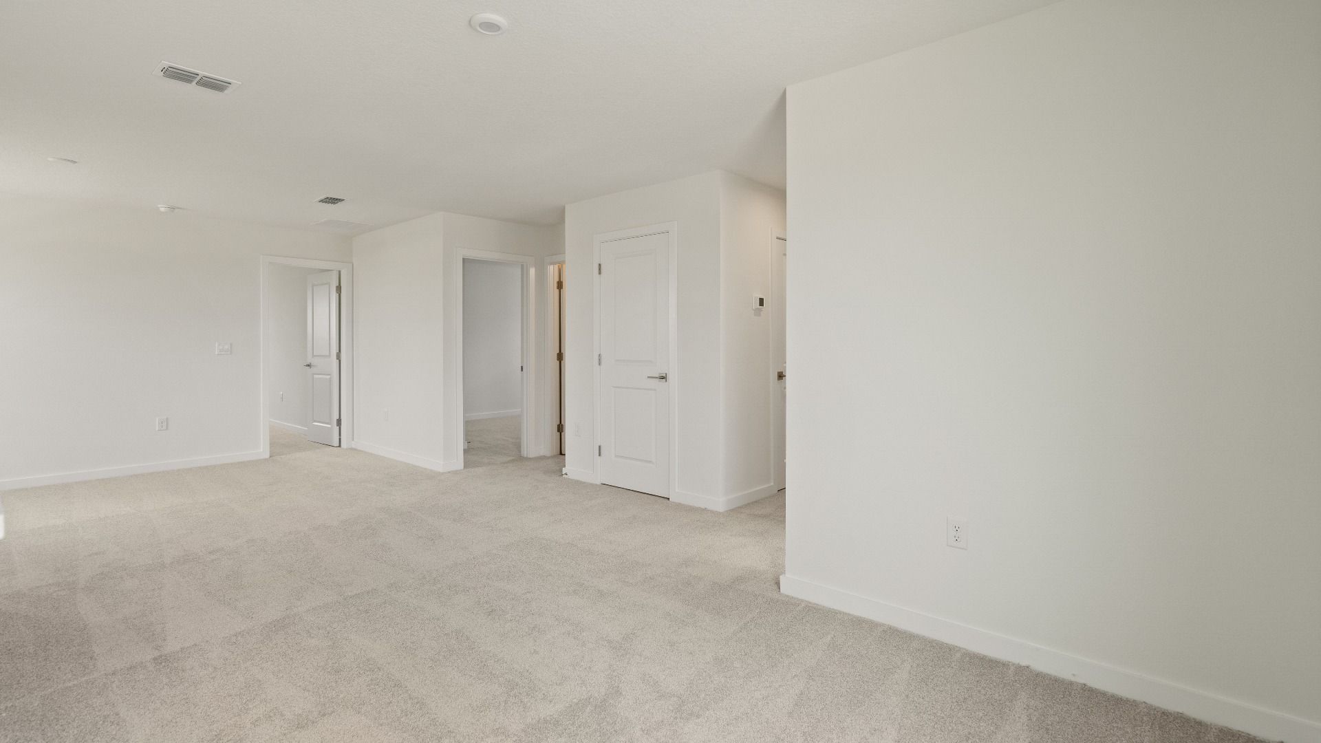 Versatile upstairs loft perfect for a media room, home gym, playroom, or secondary living area