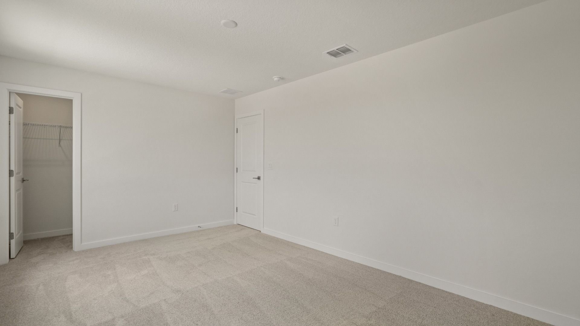 Comfortable second bedroom with roomy walk-in closet—ideal for guests, kids, or a personalized private retreat