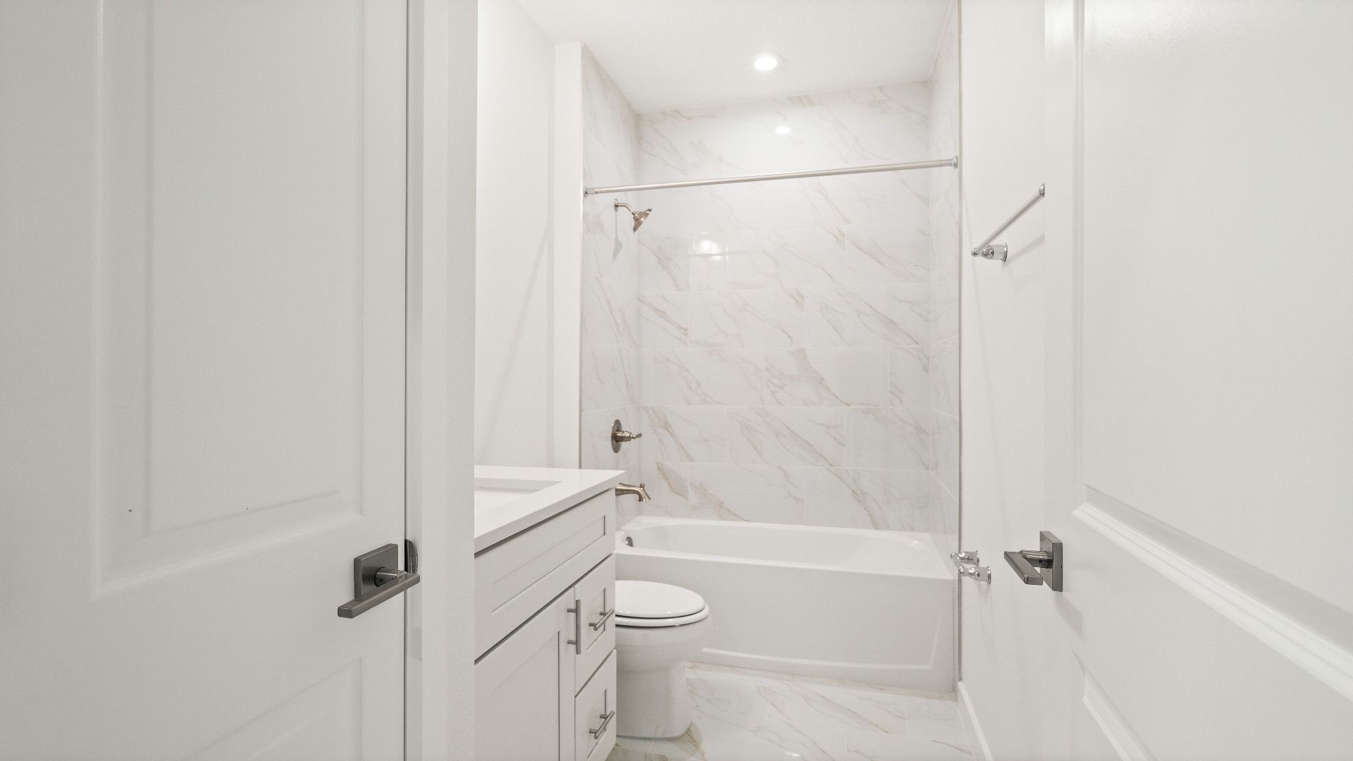 Guest bath with luxury finishes and elevated shower in the Castaway Model by DRB Homes
