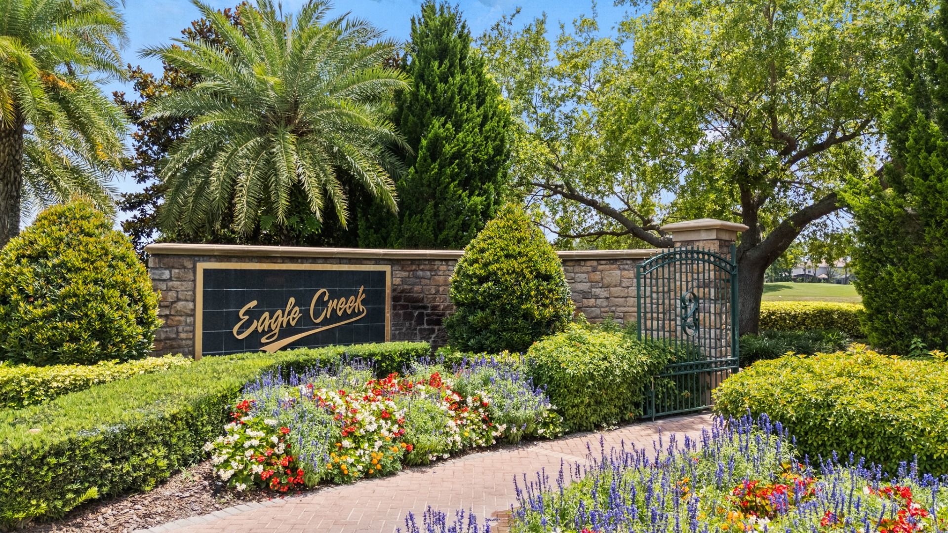 Eagle Creek community entrance in Lake Nona, FL, featuring a landscaped sign near Cyrene at Harmony.