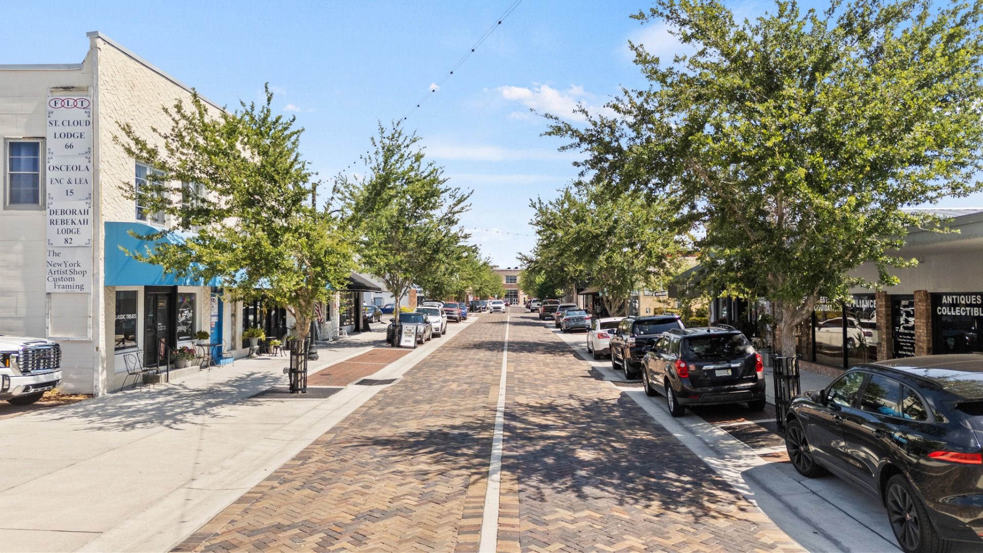 Brick-paved Main Street in downtown St. Cloud, FL offering shops, cafes, and small-town charm near Cyrene at Harmony.