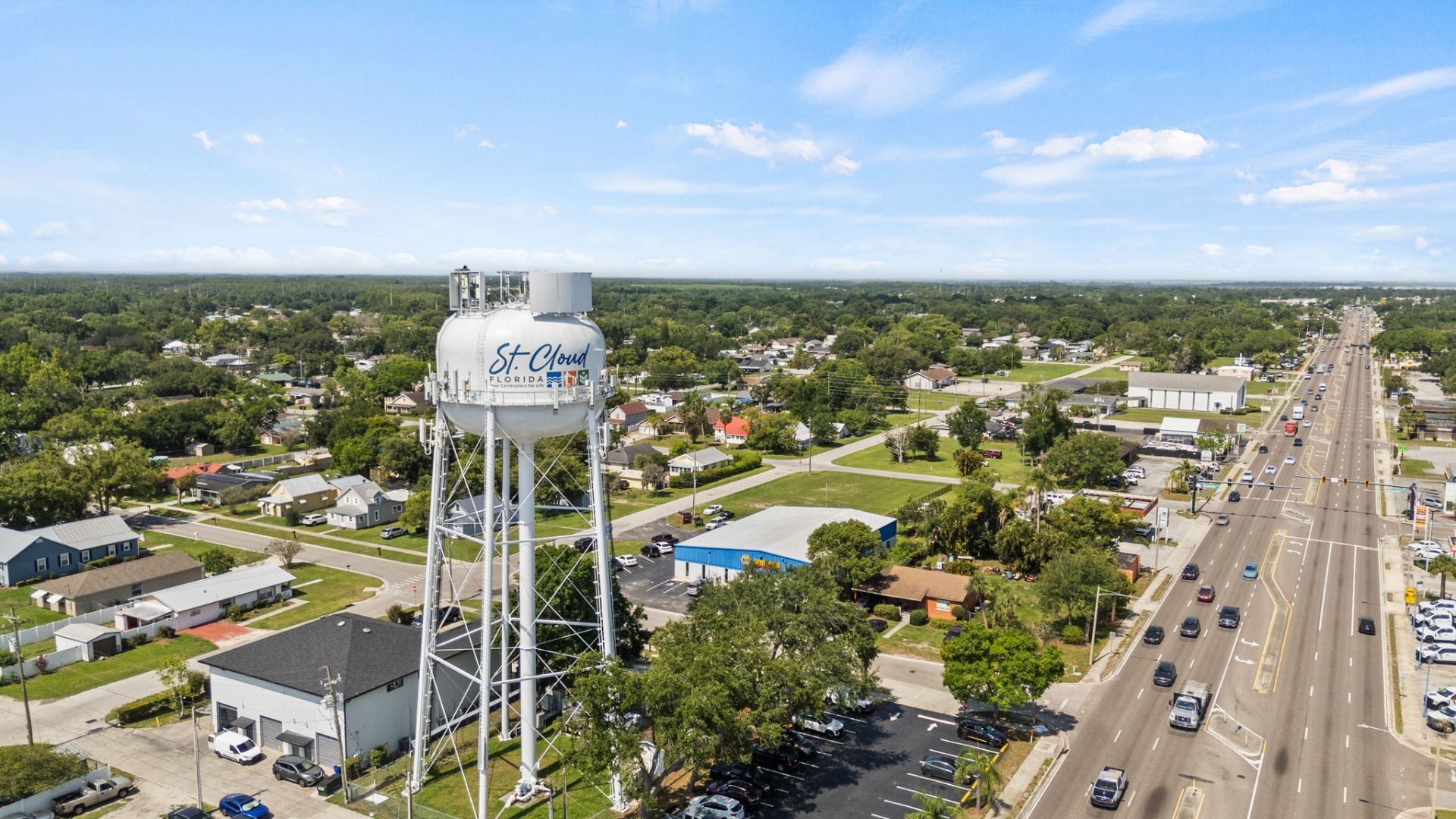 Aerial view of the St. Cloud, FL water tower overlooking city streets and neighborhoods near Cyrene at Harmony.