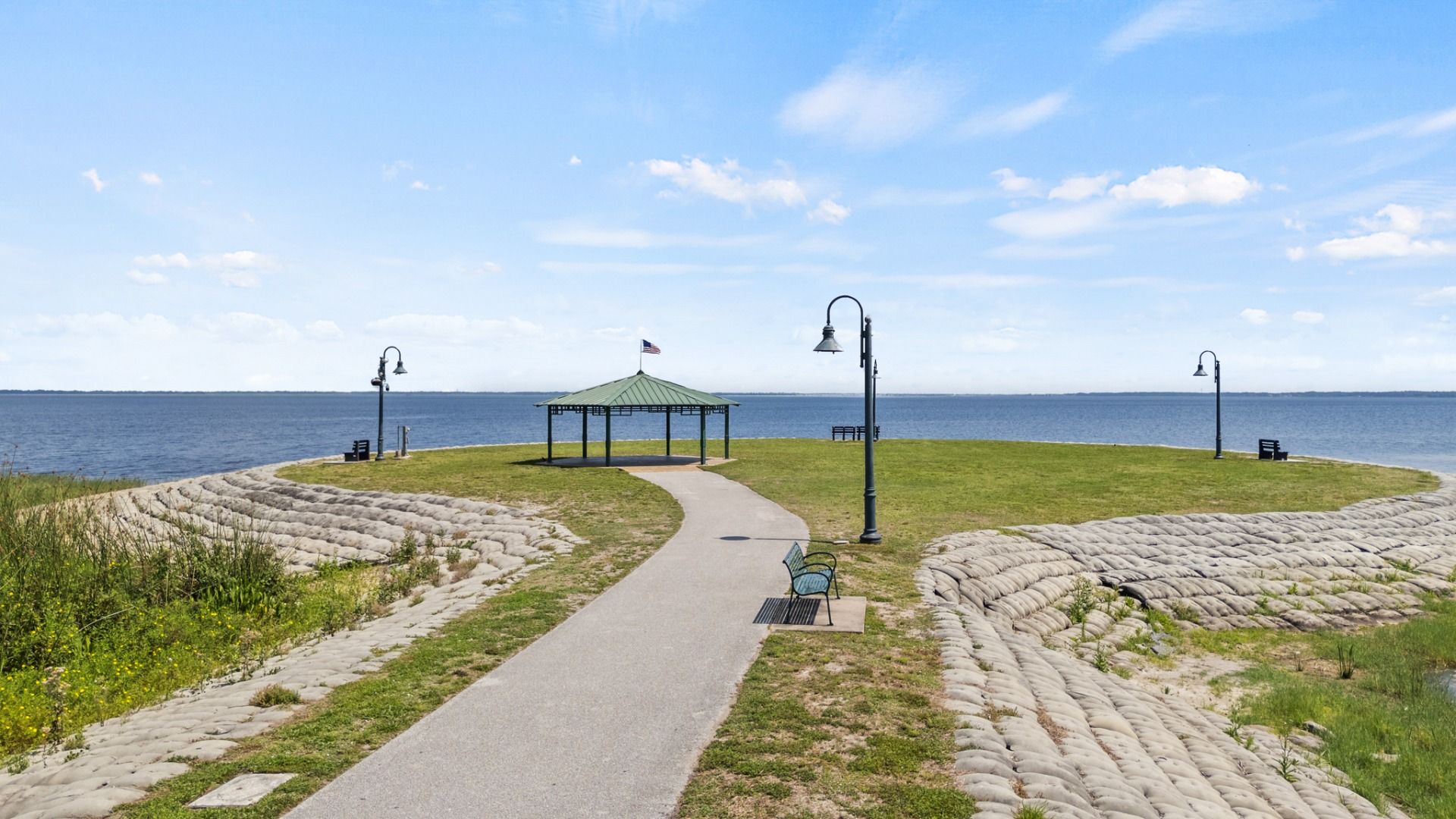 Gazebo at Lakefront Park on Lake Tohopekaliga in St. Cloud, FL offering scenic views and a peaceful walking path.