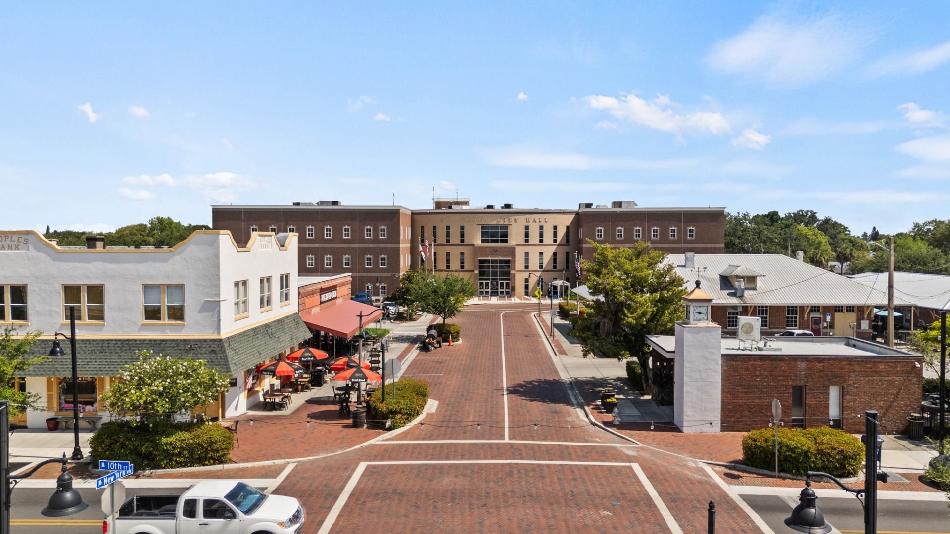 Brick-paved street to St. Cloud City Hall with shops & dining in historic downtown St. Cloud, FL near Cyrene at Harmony.