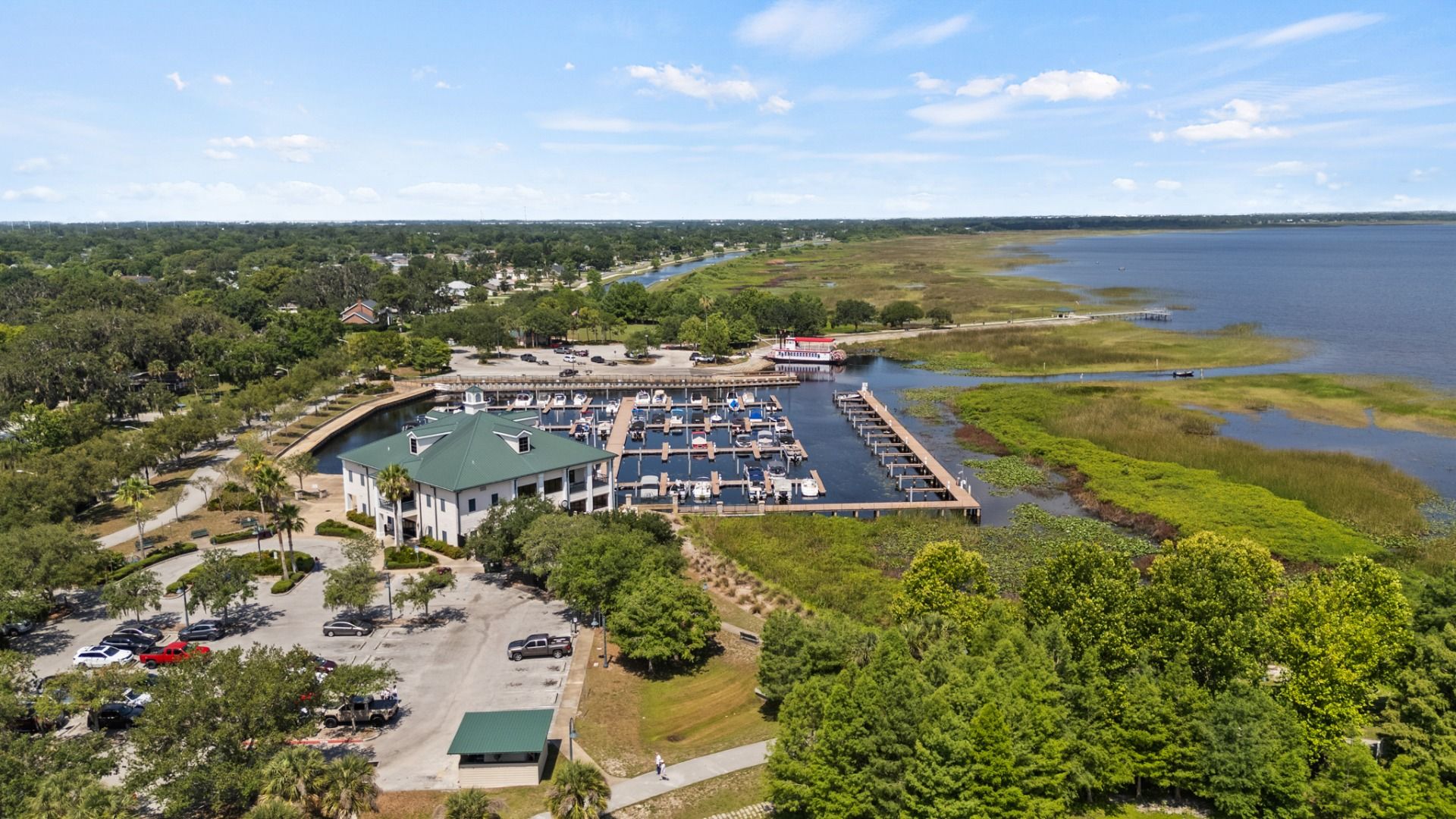 Aerial view of St. Cloud Marina with boat docks and scenic Lake Tohopekaliga shoreline near Cyrene at Harmony.
