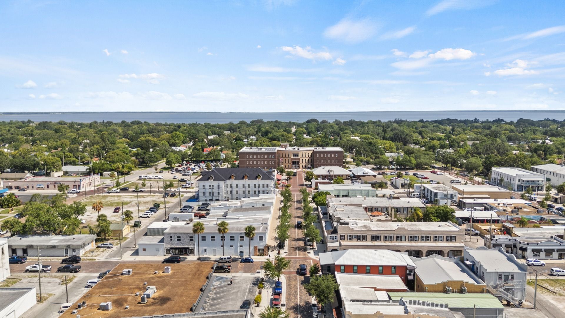 Brick-paved street to St. Cloud City Hall with shops & dining in historic downtown St. Cloud, FL near Cyrene at Harmony.