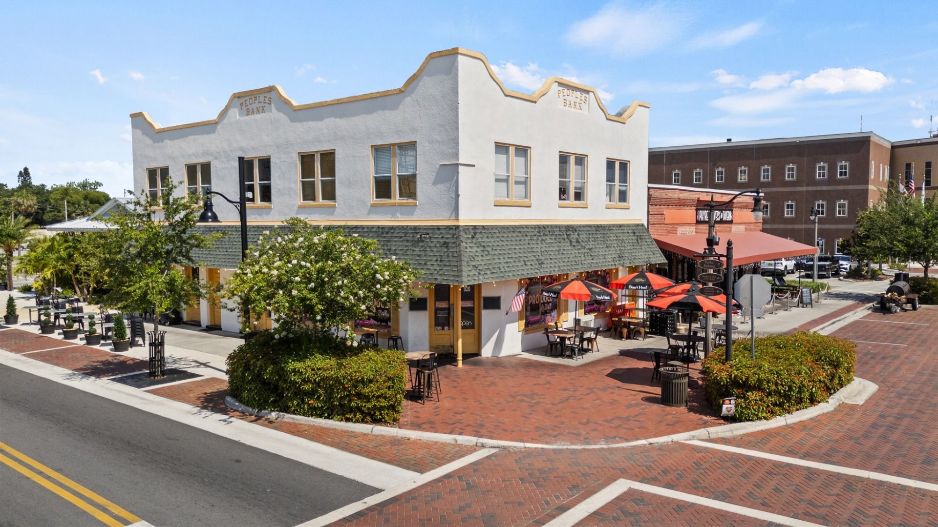 Historic bank building with outdoor dining in downtown St. Cloud, FL offering charm and character near Cyrene at Harmony.