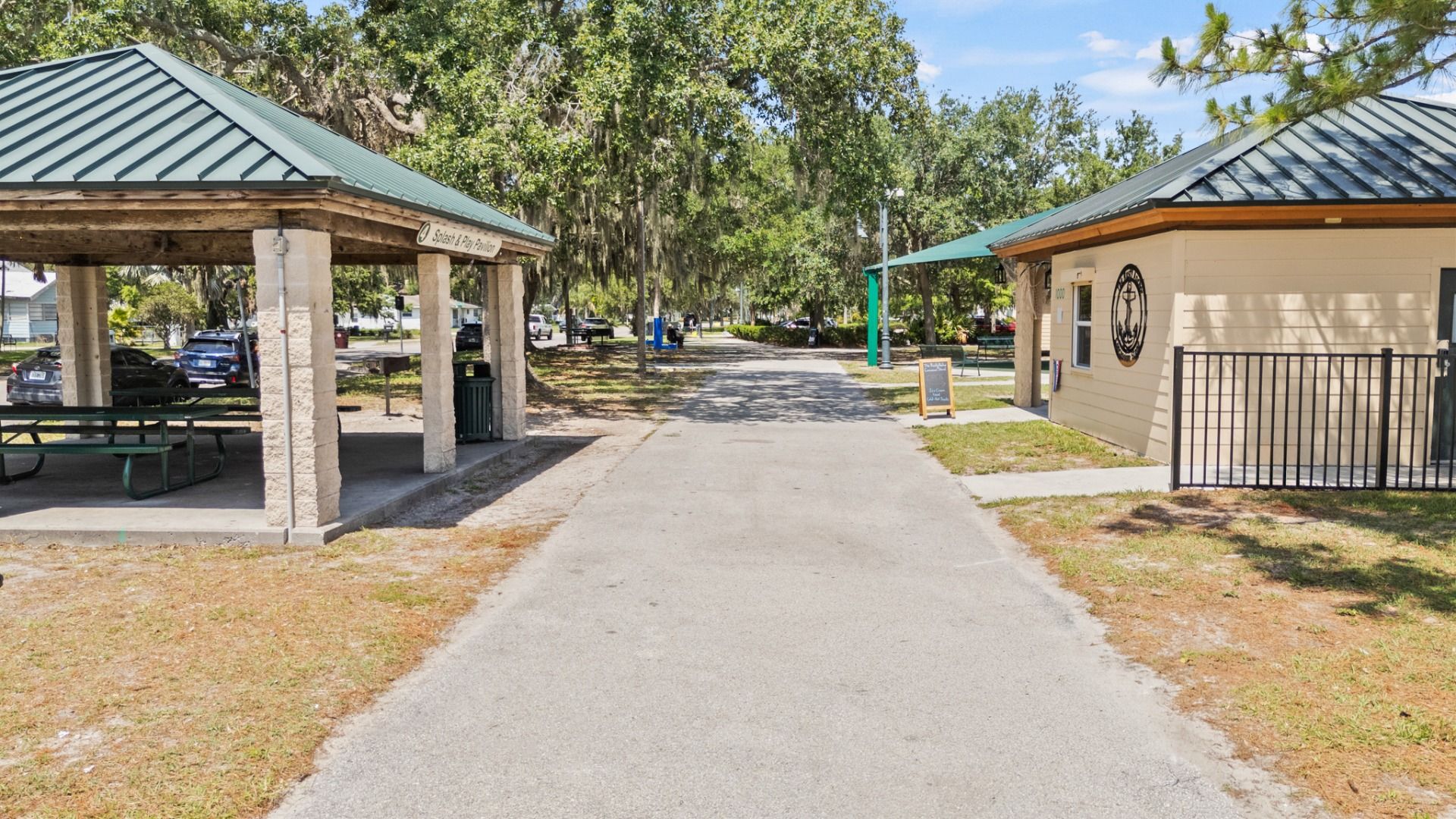 Pavilion and shaded walking path at Lakefront Park in St. Cloud, FL—perfect for picnics and relaxation near Cyrene at Harmony