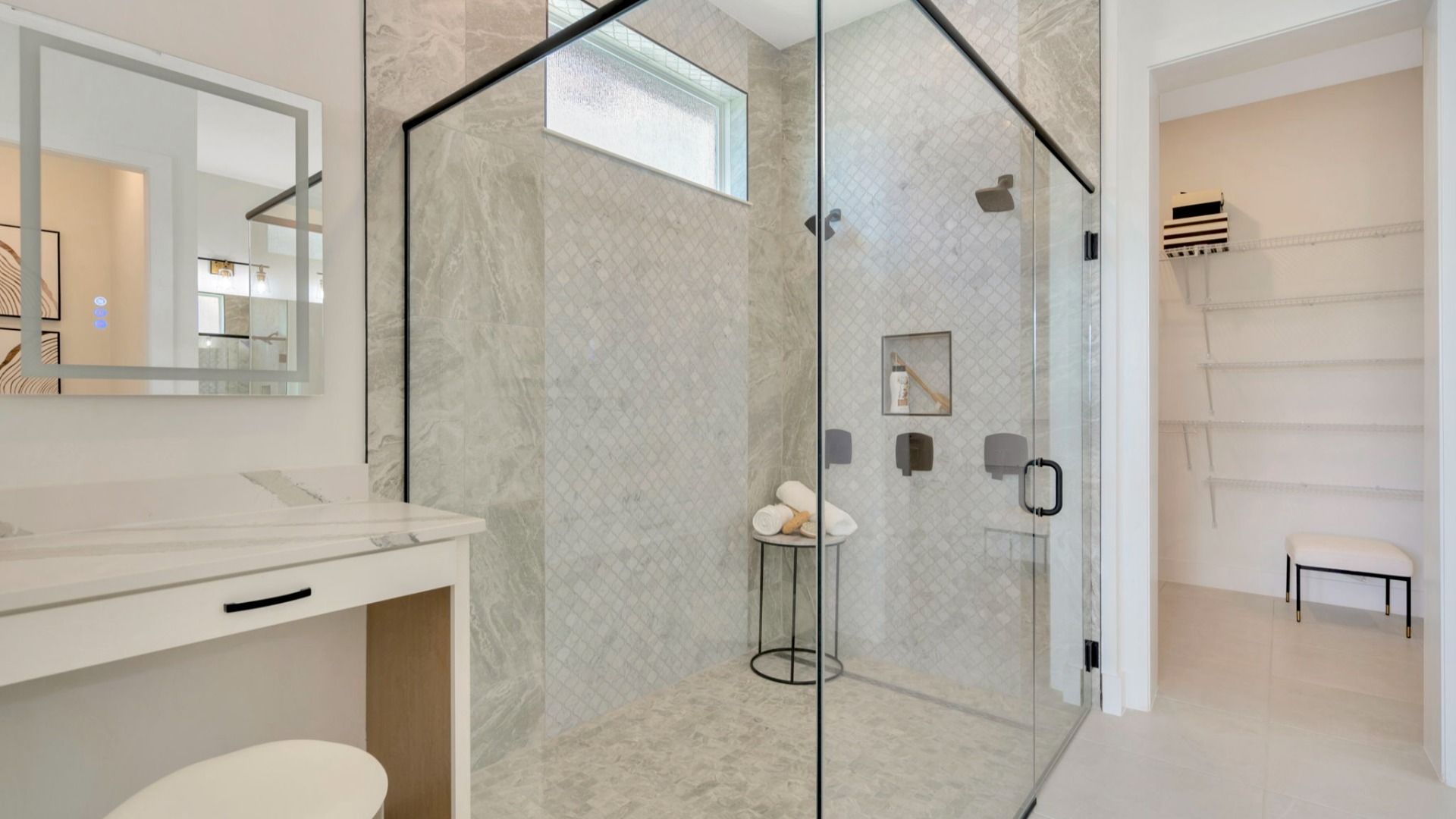 The Primary Bathroom of a DRB Homes Grand Eider model, which is a home plan offered at Serengeti in Spring Hill, FL.