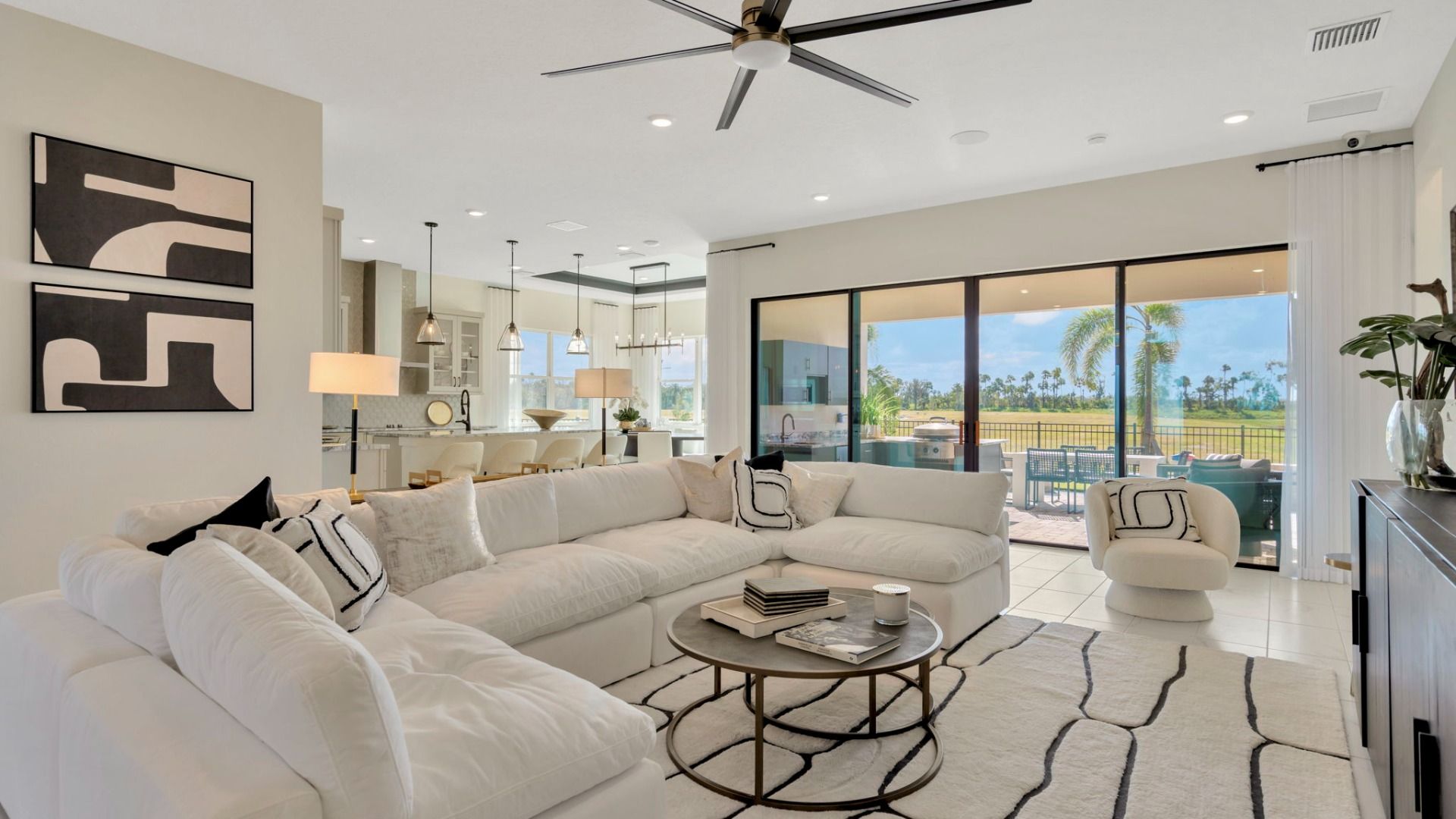 The Living Room of a DRB Homes Grand Eider model, which is a home plan offered at Serengeti in Spring Hill, FL.