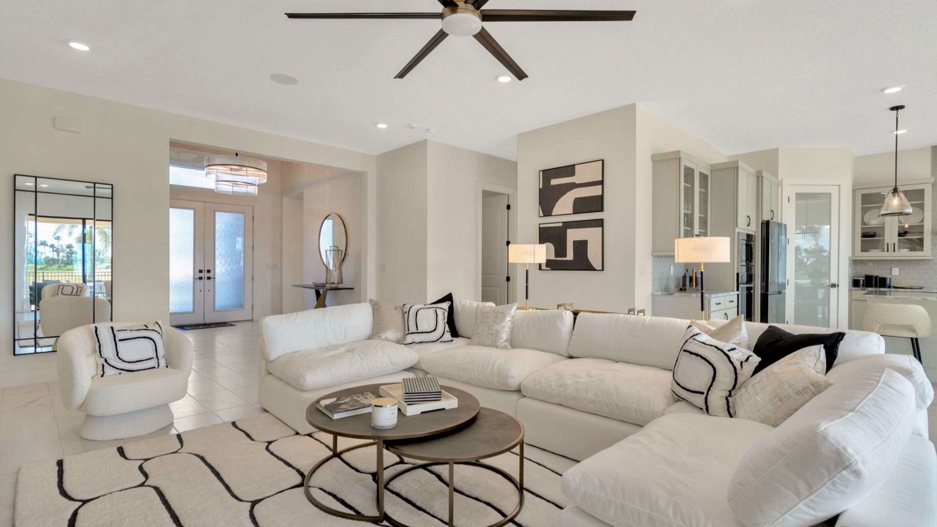 The Living Room of a DRB Homes Grand Eider model, which is a home plan offered at Serengeti in Spring Hill, FL.