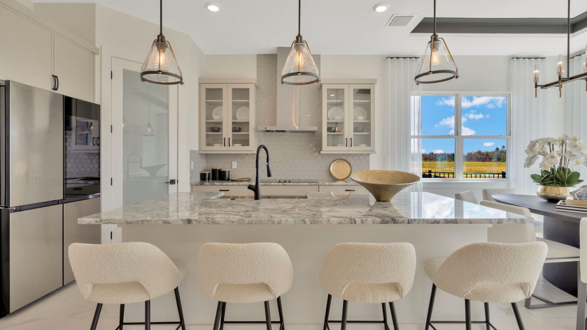 The Kitchen of a DRB Homes Grand Eider model, which is a home plan offered at Serengeti in Spring Hill, FL.