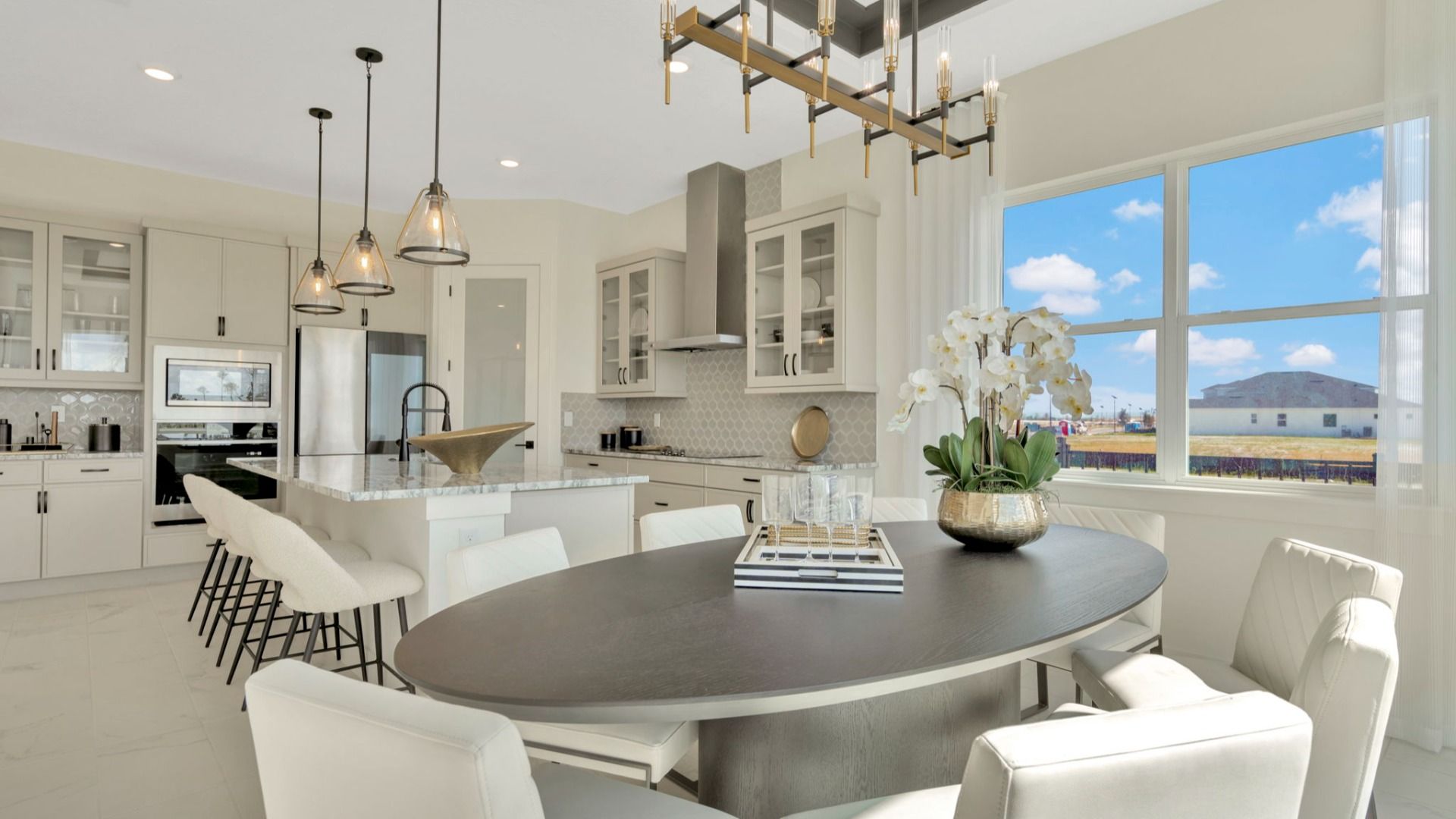 The Dining Room of a DRB Homes Grand Eider model, which is a home plan offered at Serengeti in Spring Hill, FL.