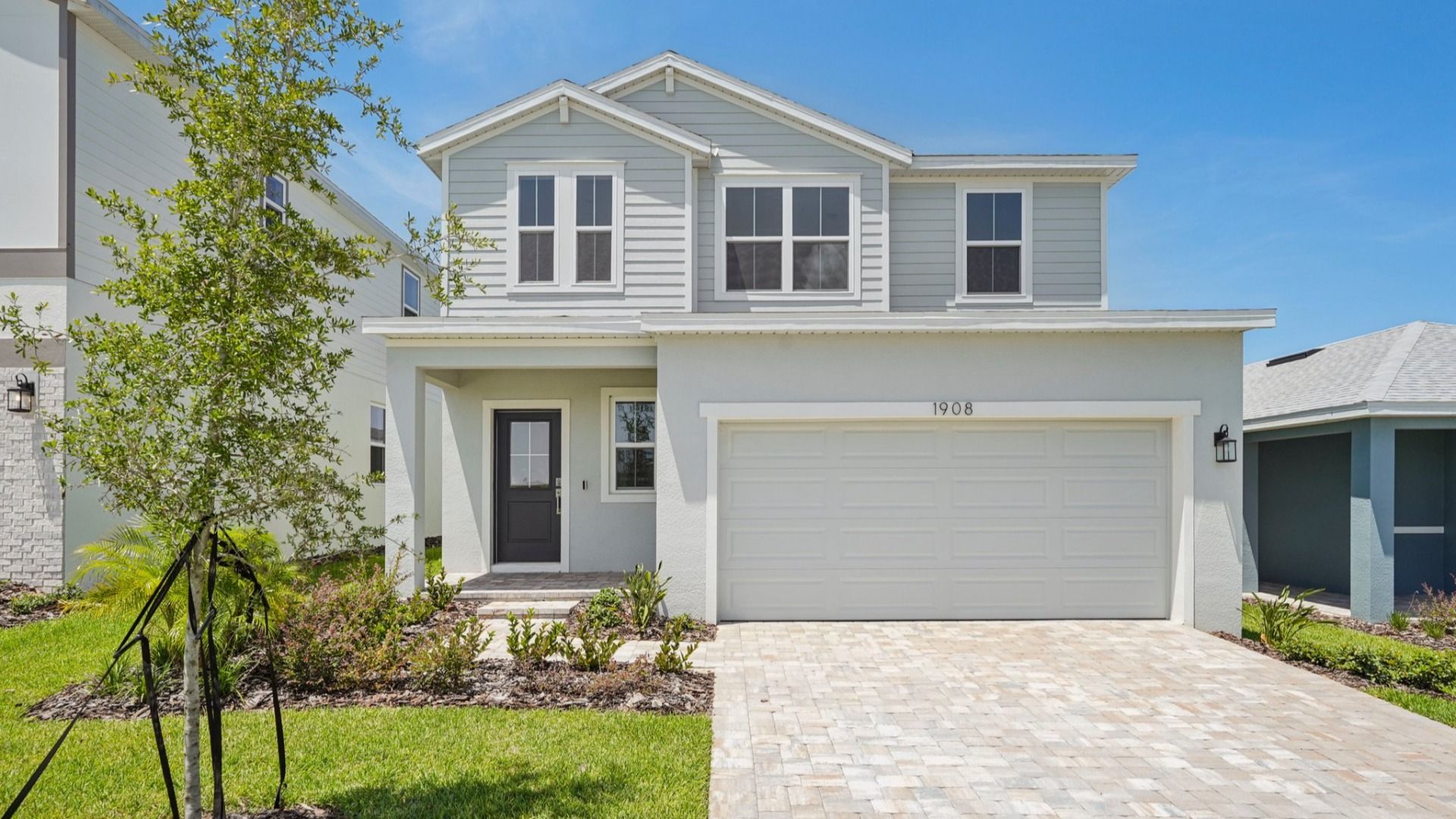 Jupiter Exterior Elevation in Hamilton Bluff by DRB Homes located in Haines City, FL.