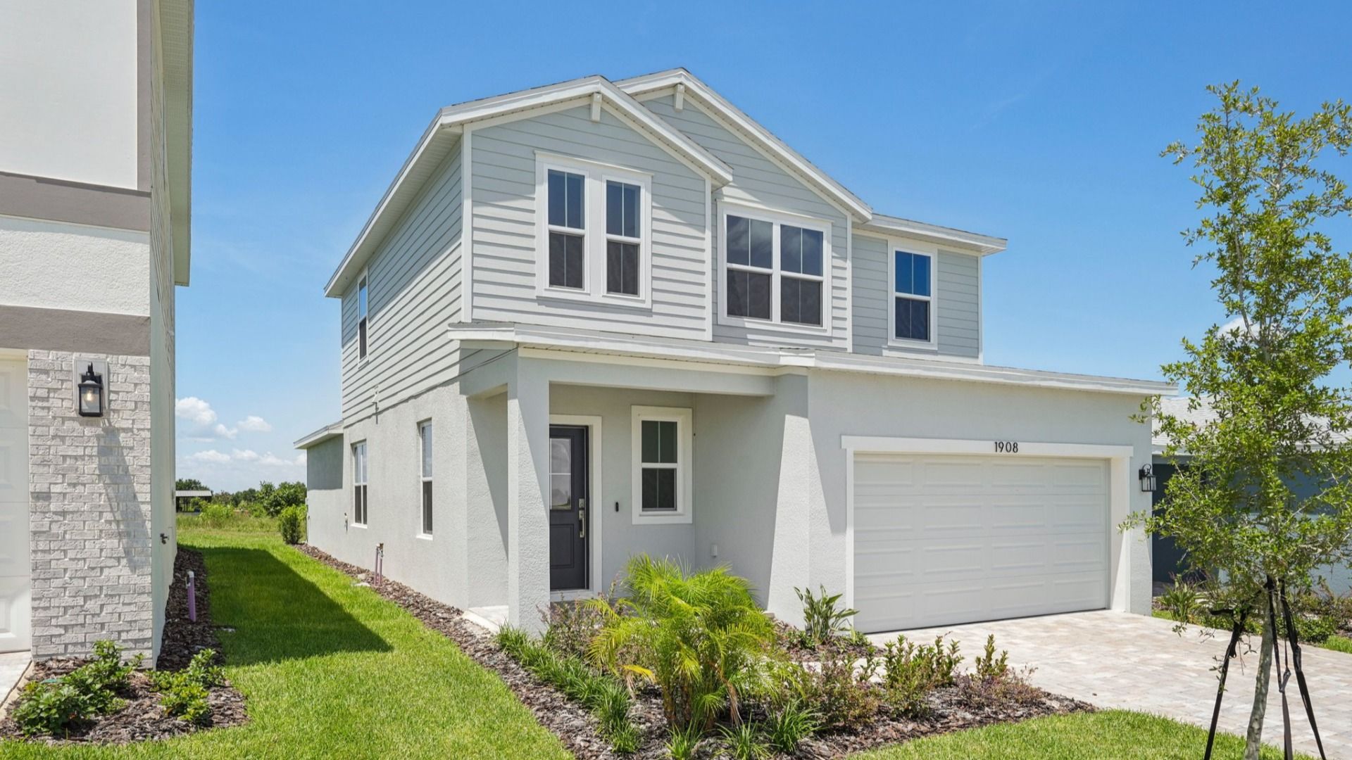 Jupiter Exterior Elevation in Hamilton Bluff by DRB Homes located in Haines City, FL.