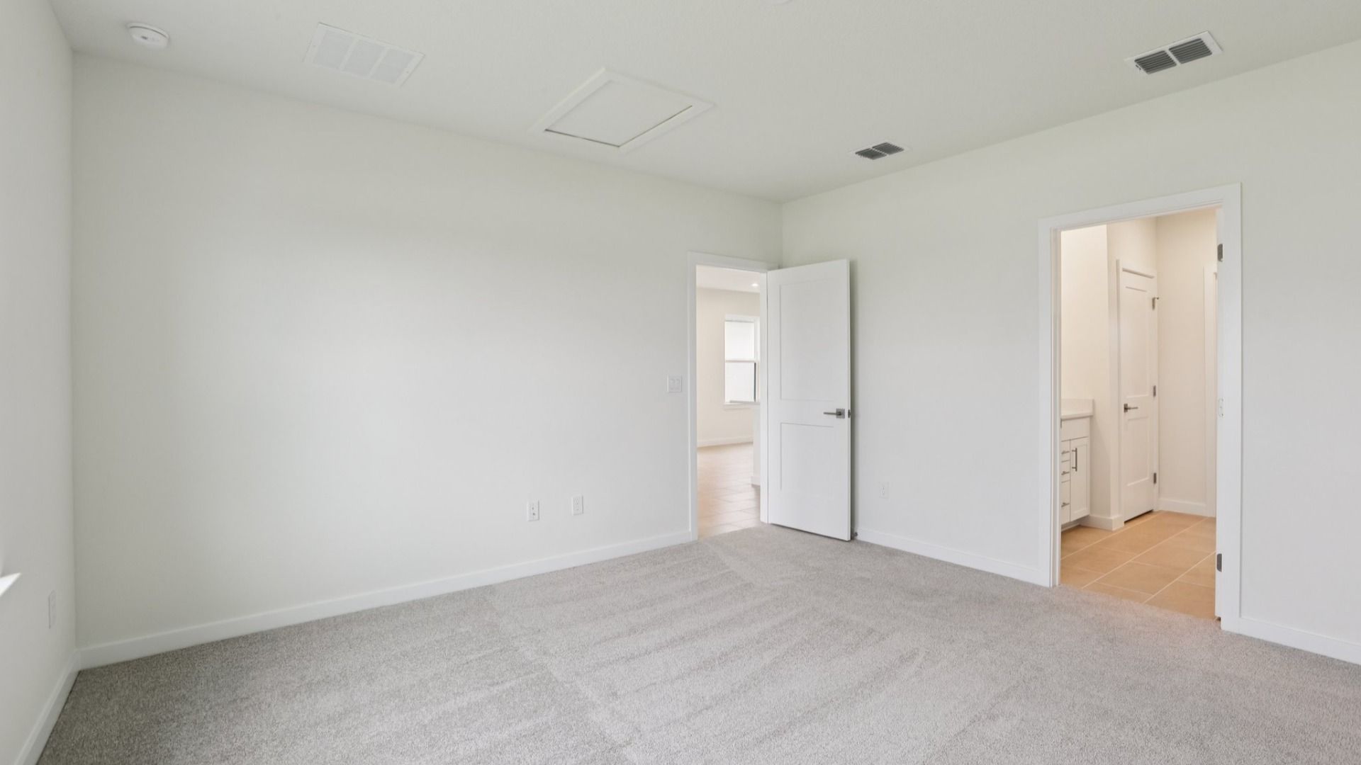 Naples First Floor Primary Suite with en suite bath with large walk-in closet at Grasslands West in Lakeland FL
