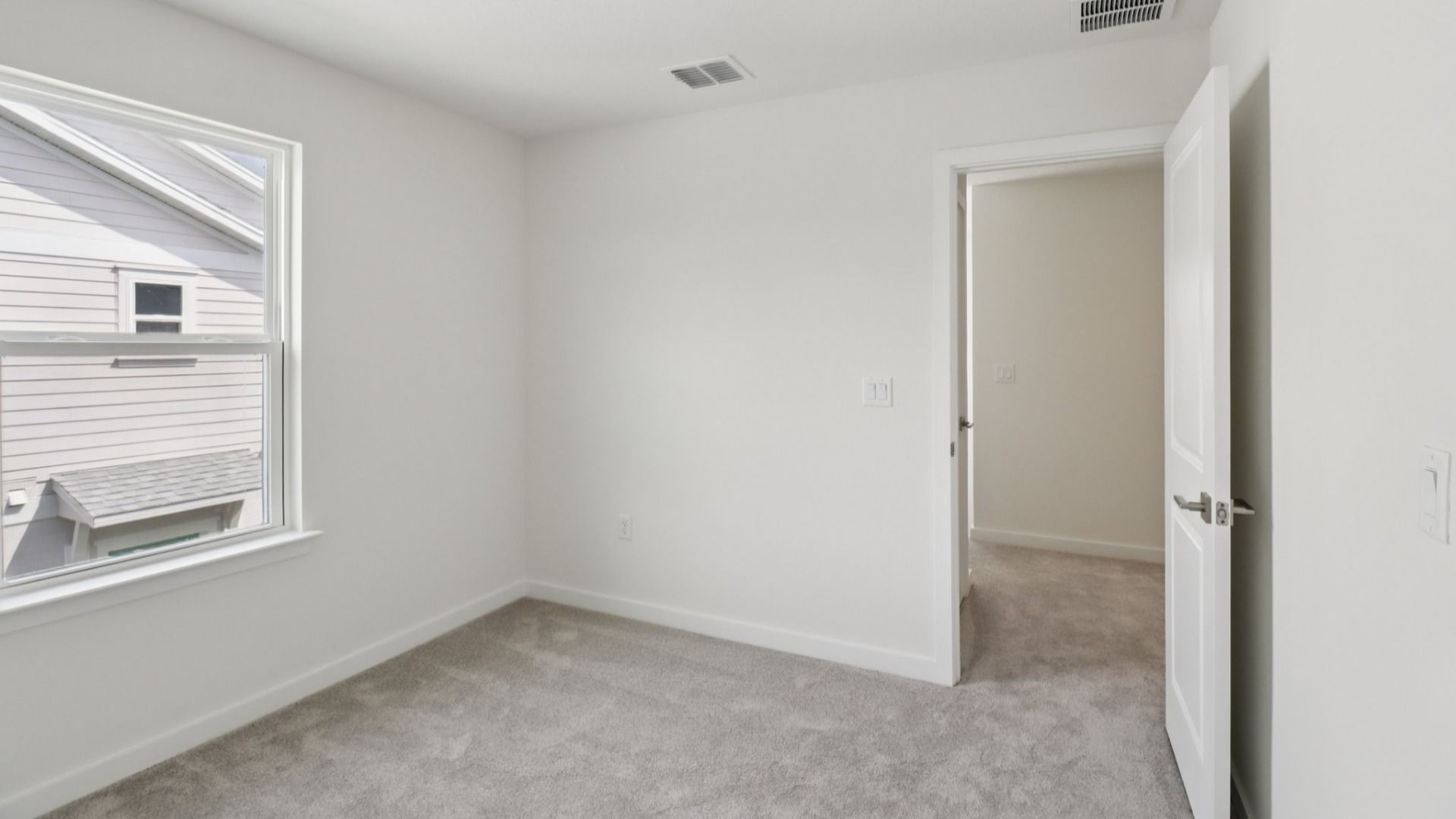Guest Bed in the Monterey End Townhome by DRB Homes - Cyrene at Harmony in St Cloud FL