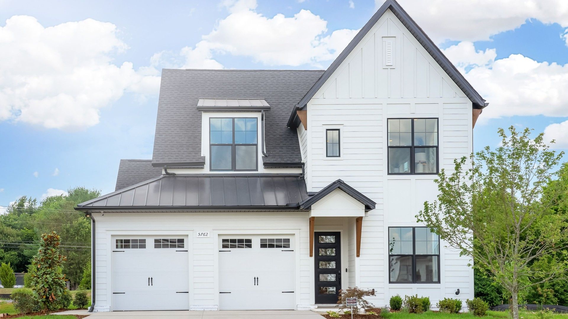 Exquisite modern facade with sleek black roof and expansive windows in Shelton Square, Tennessee.