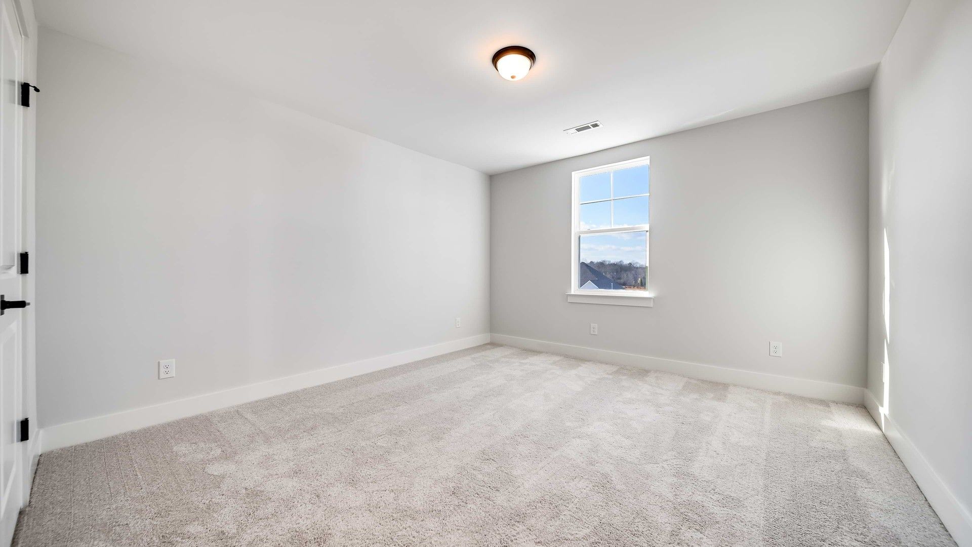 Luxurious modern room featuring plush carpet and soft natural light, Richvale Estates.