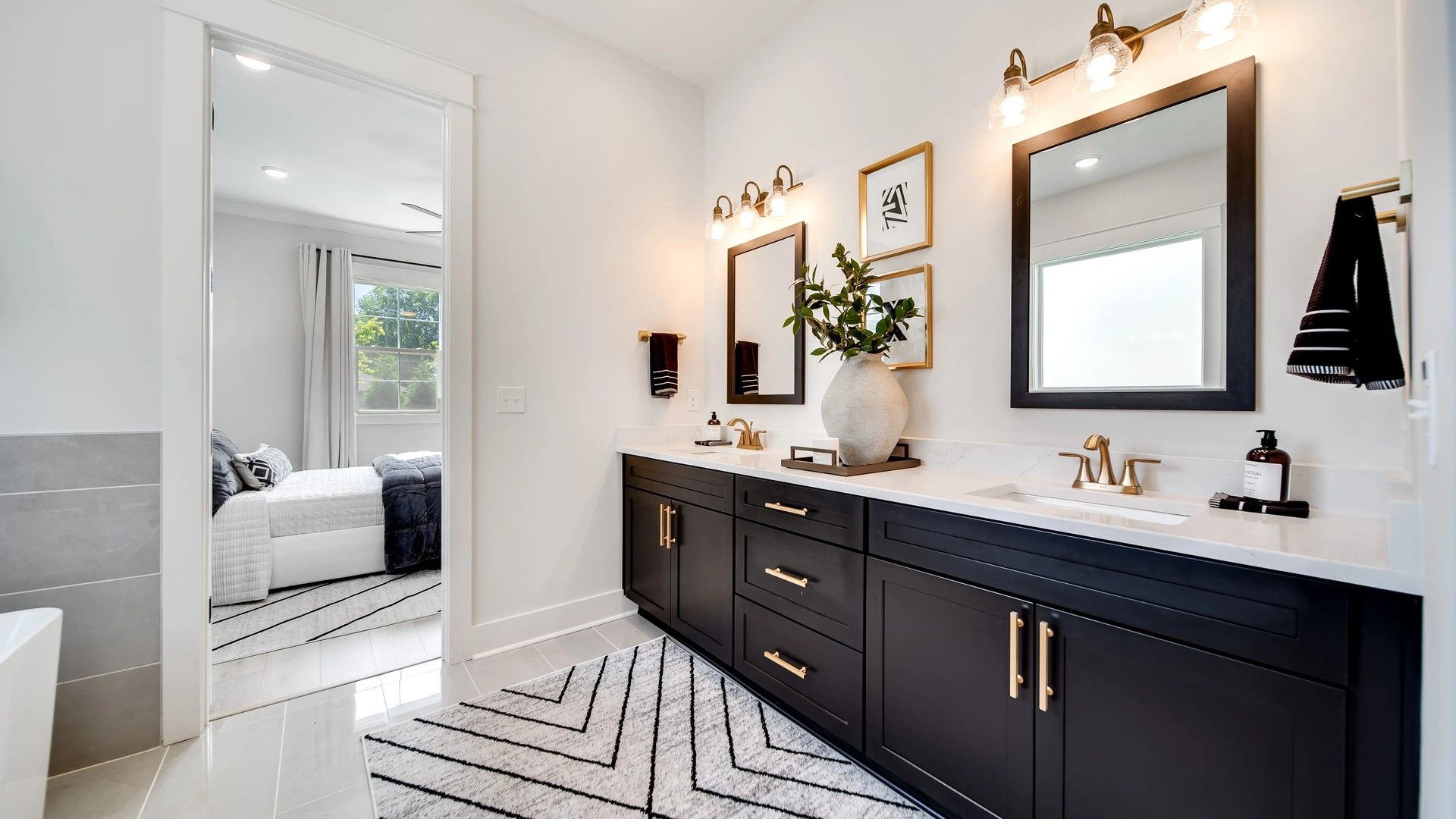 Experience refined luxury with marble countertops and dark cabinetry in Shelton Square's exquisite bathroom.