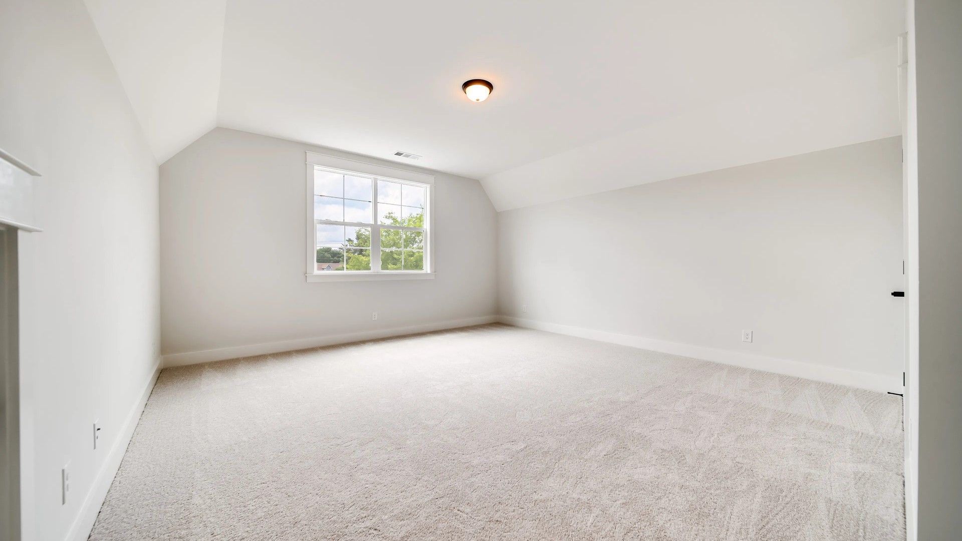 Luxurious vaulted ceilings and plush carpeting enhance this serene Shelton Square retreat.