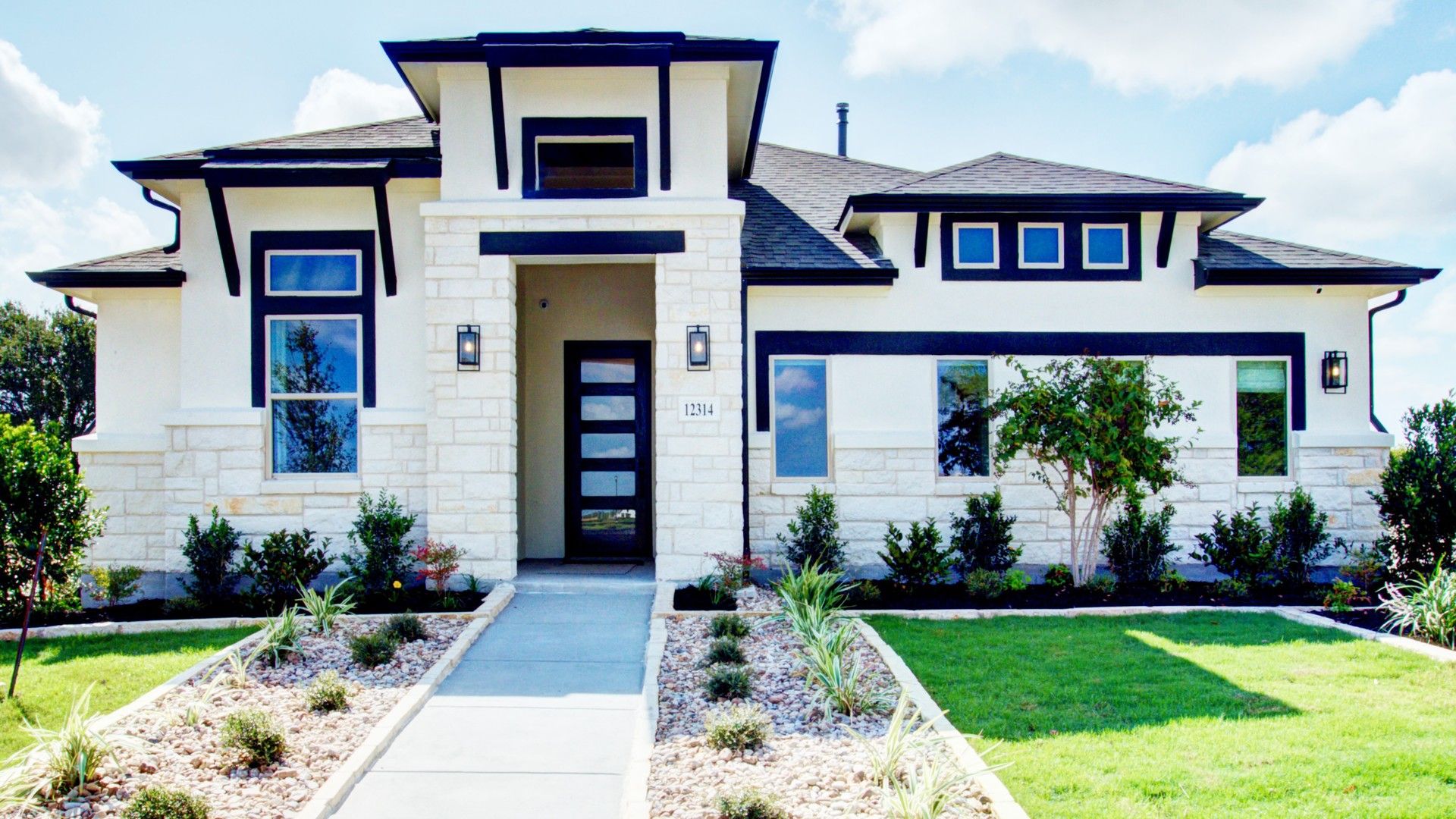 Experience elegant stonework and sleek lines in this modern home at The Crossvine, Texas.