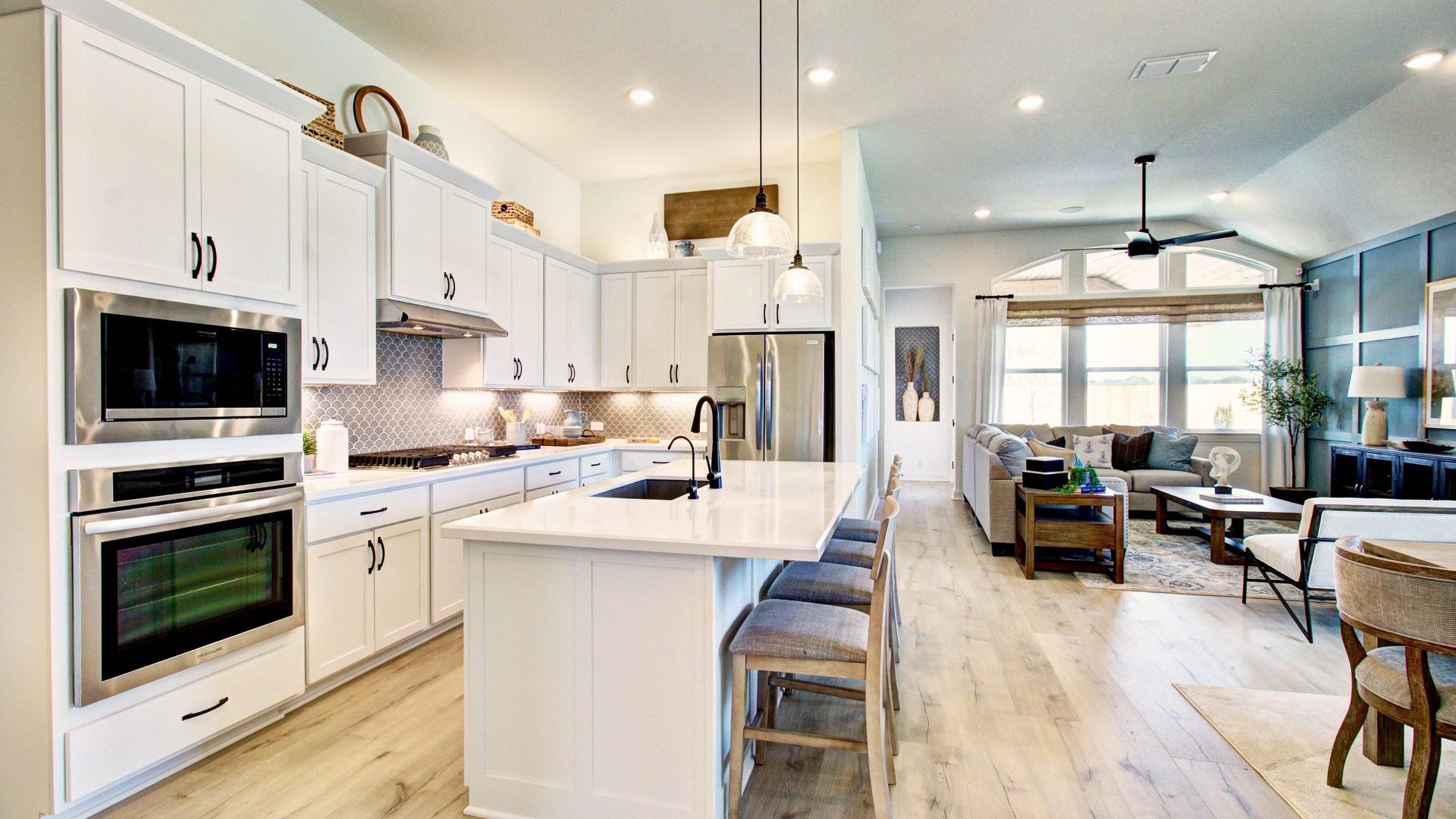 Exquisite open-plan kitchen with sleek island, airy living space, and elegant finishes in Veranda community.