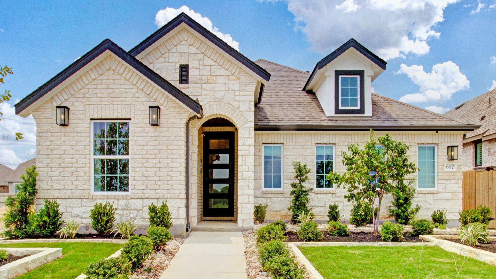 This Sunflower Ridge home boasts exquisite brickwork and lush landscaping, ideal for luxury living.