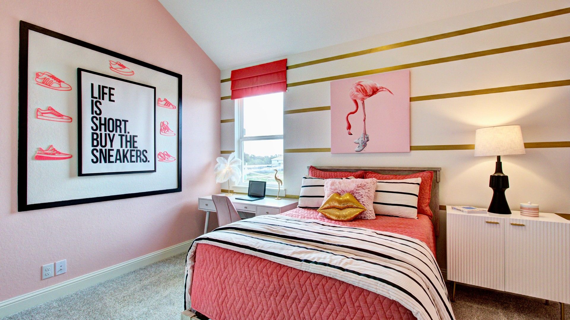 Chic pink decor meets modern furnishings in this Veranda community bedroom. Unique art and cozy textures enhance luxury.