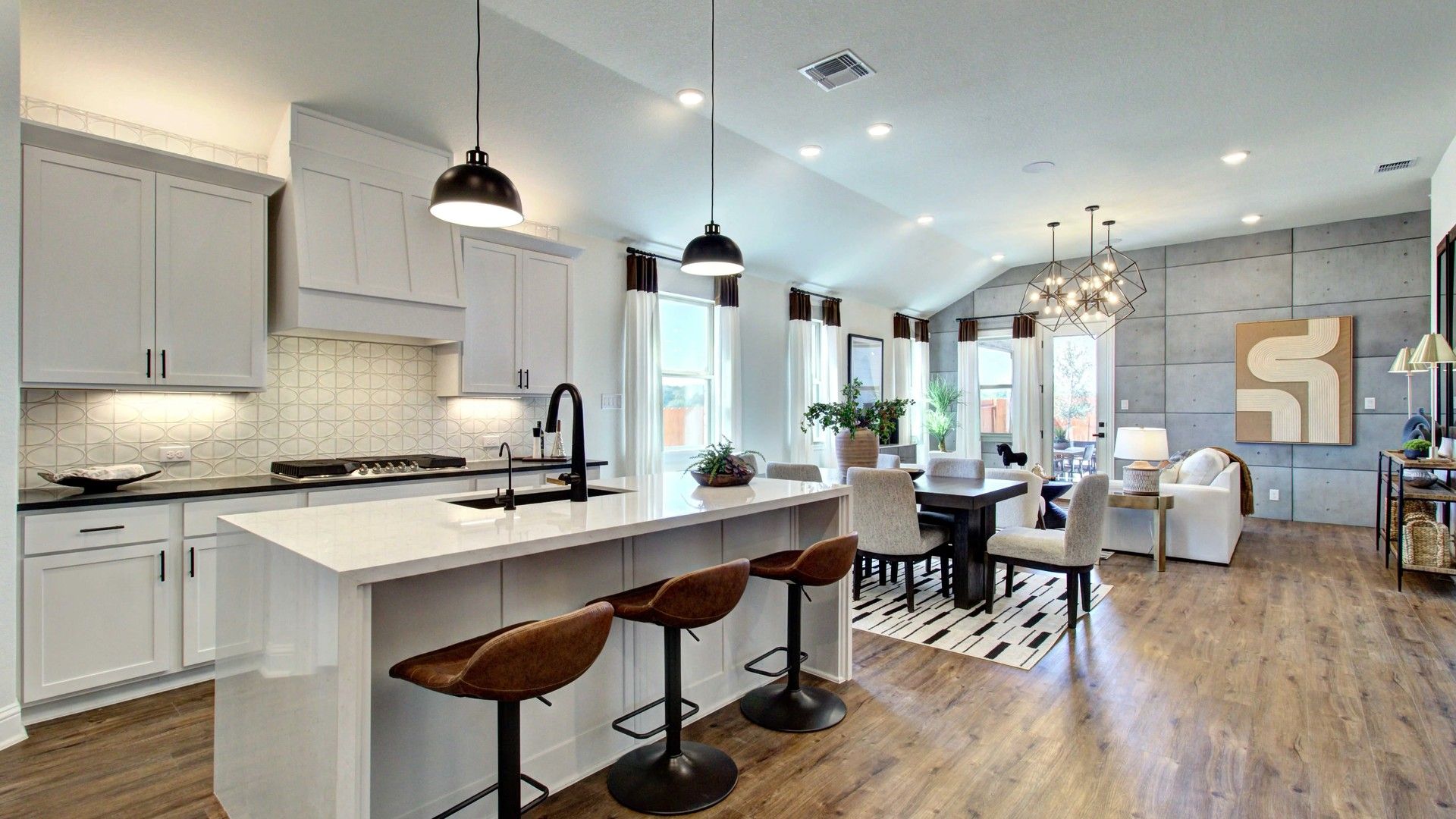 Expansive open design with high ceilings, luxurious finishes, and stylish lighting in Meyer Ranch's serene setting.