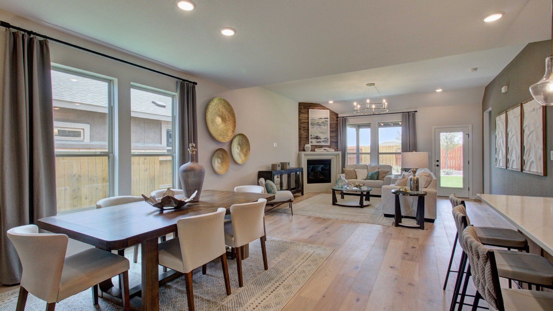Elegant hardwood floors and a chic fireplace highlight this Meyer Ranch home's luxurious living space.