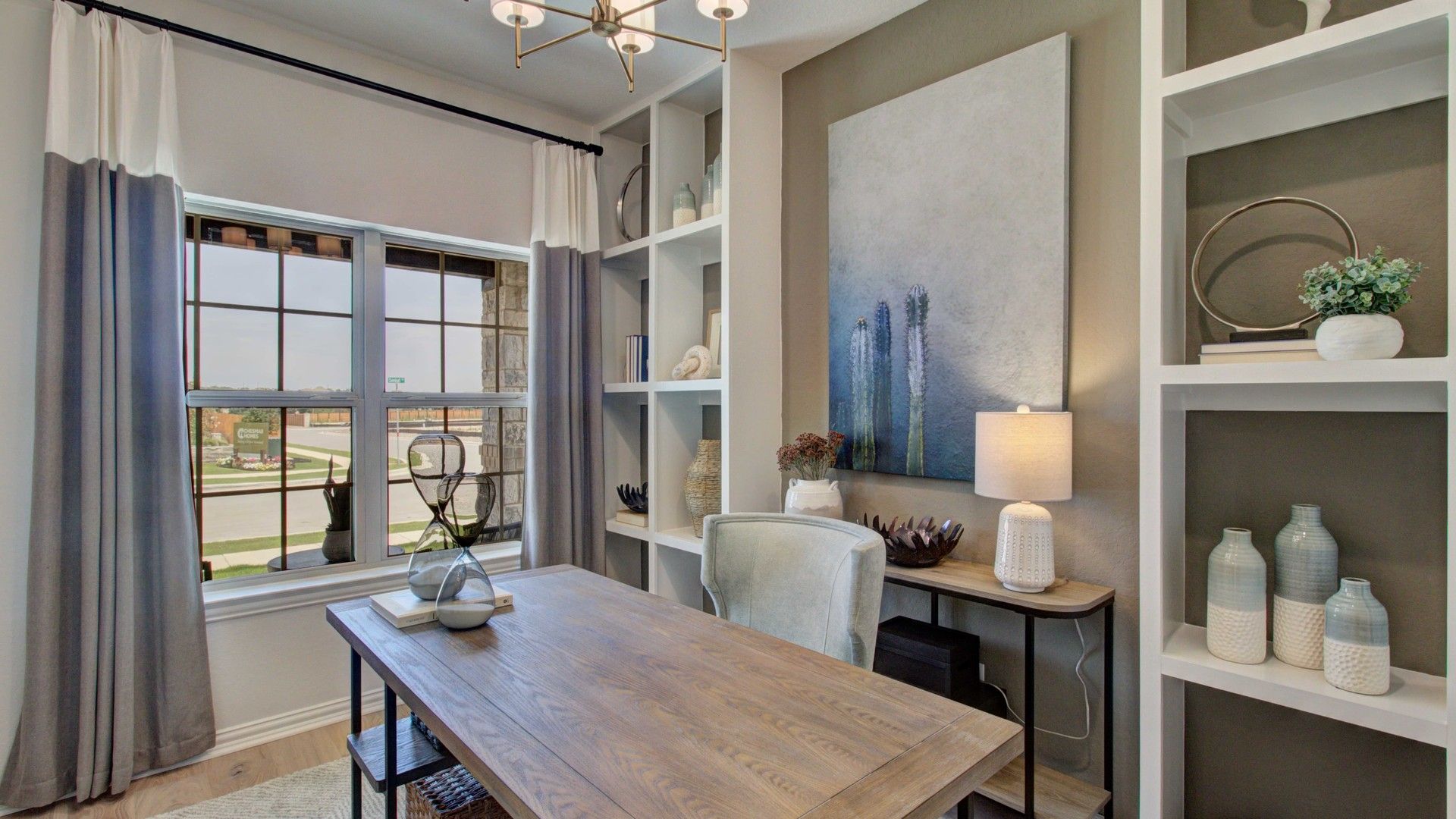 Elegant home office featuring custom built-in shelves and modern decor in Meyer Ranch, Enclave community.