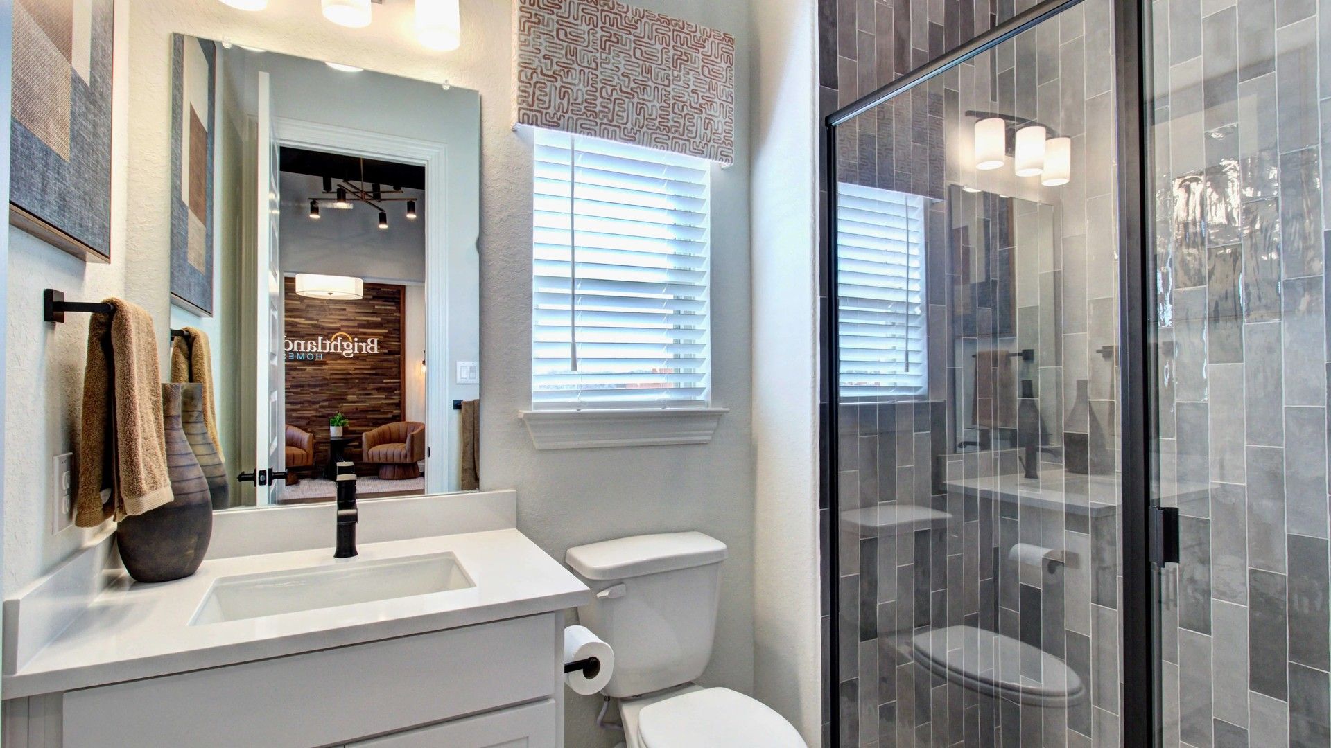 Elegant glass shower and modern vanity offer a sophisticated touch in this Meyer Ranch bathroom.